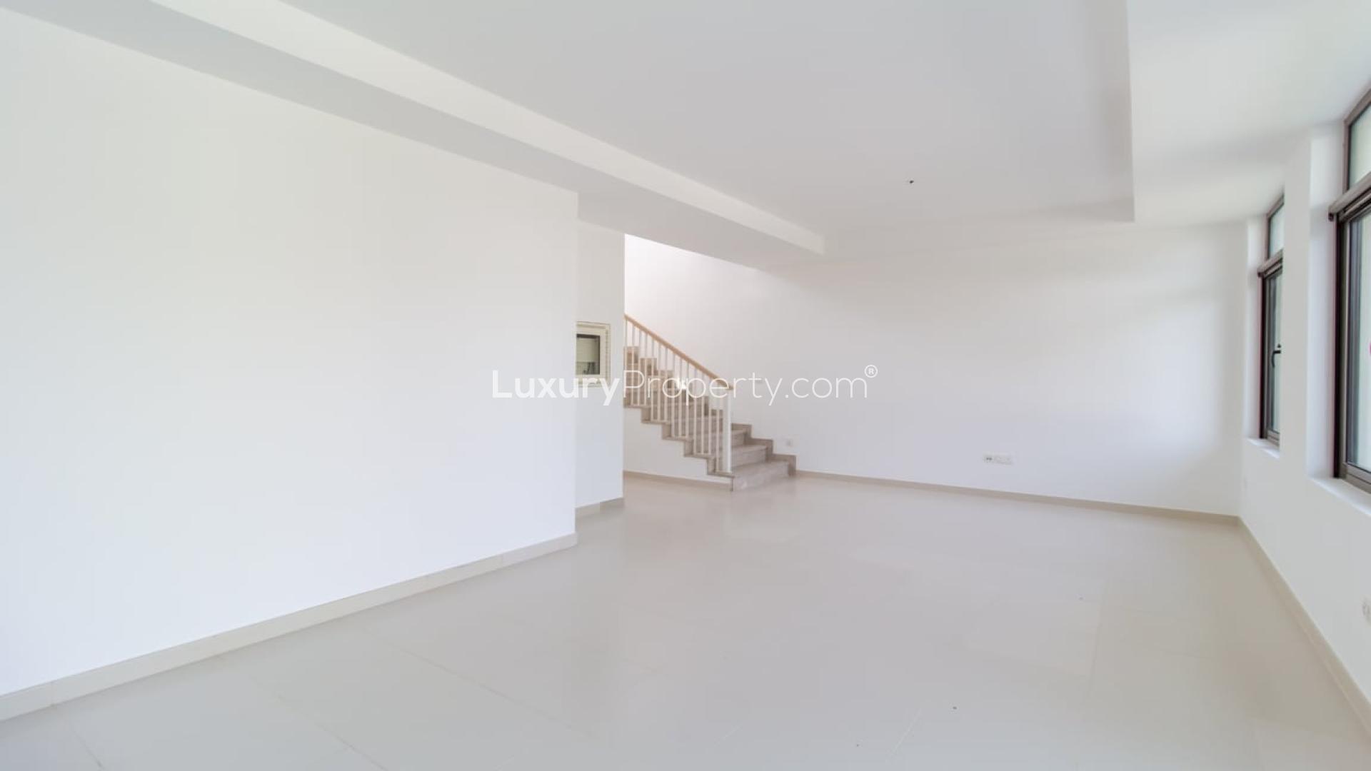 Modern kitchen with granite countertops in Mira Oasis villa, Reem community, available for rent