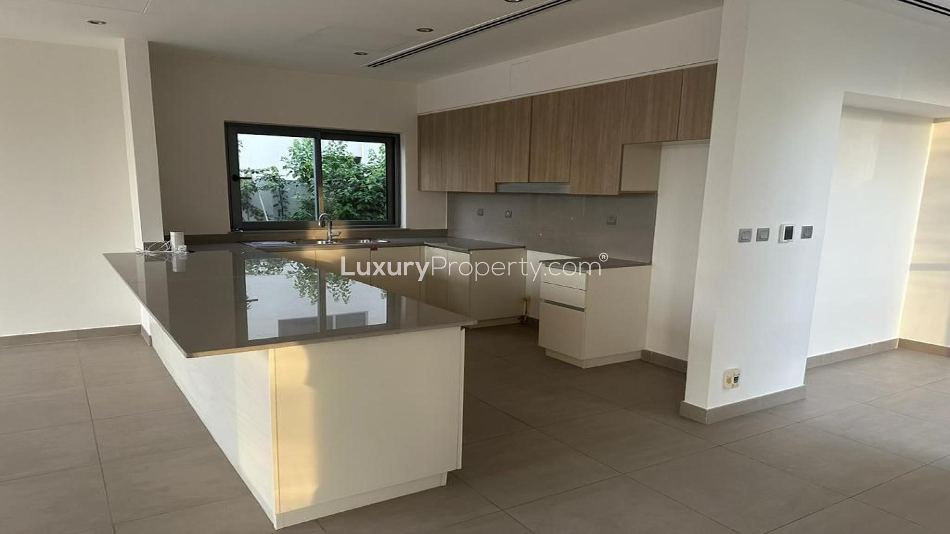 "Spacious villa interior with large windows in Sidra Villas, Dubai Hills Estate.",Modern kitchen in Sidra Villas, Dubai Hills Estate, featuring sleek countertops and ample cabinetry