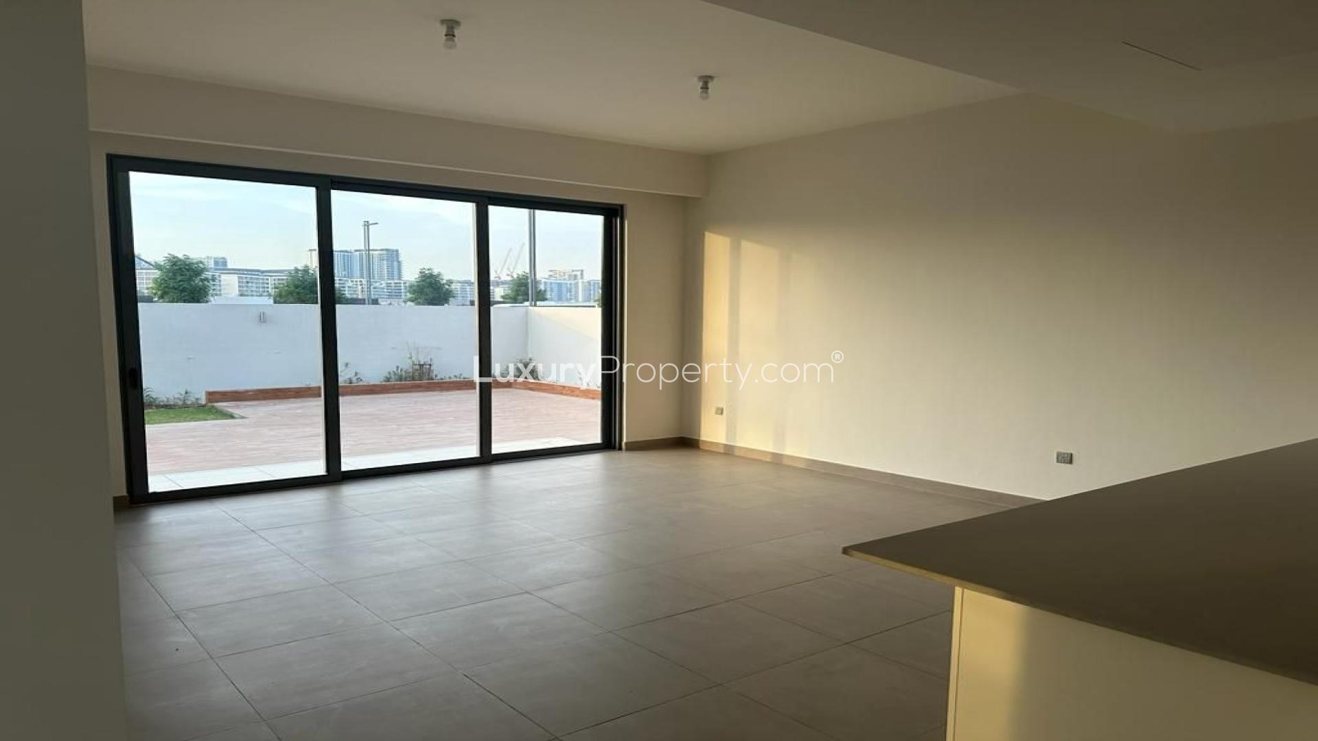 Exterior view of 3-bedroom villa with large patio and garden in Sidra Villas, Dubai Hills