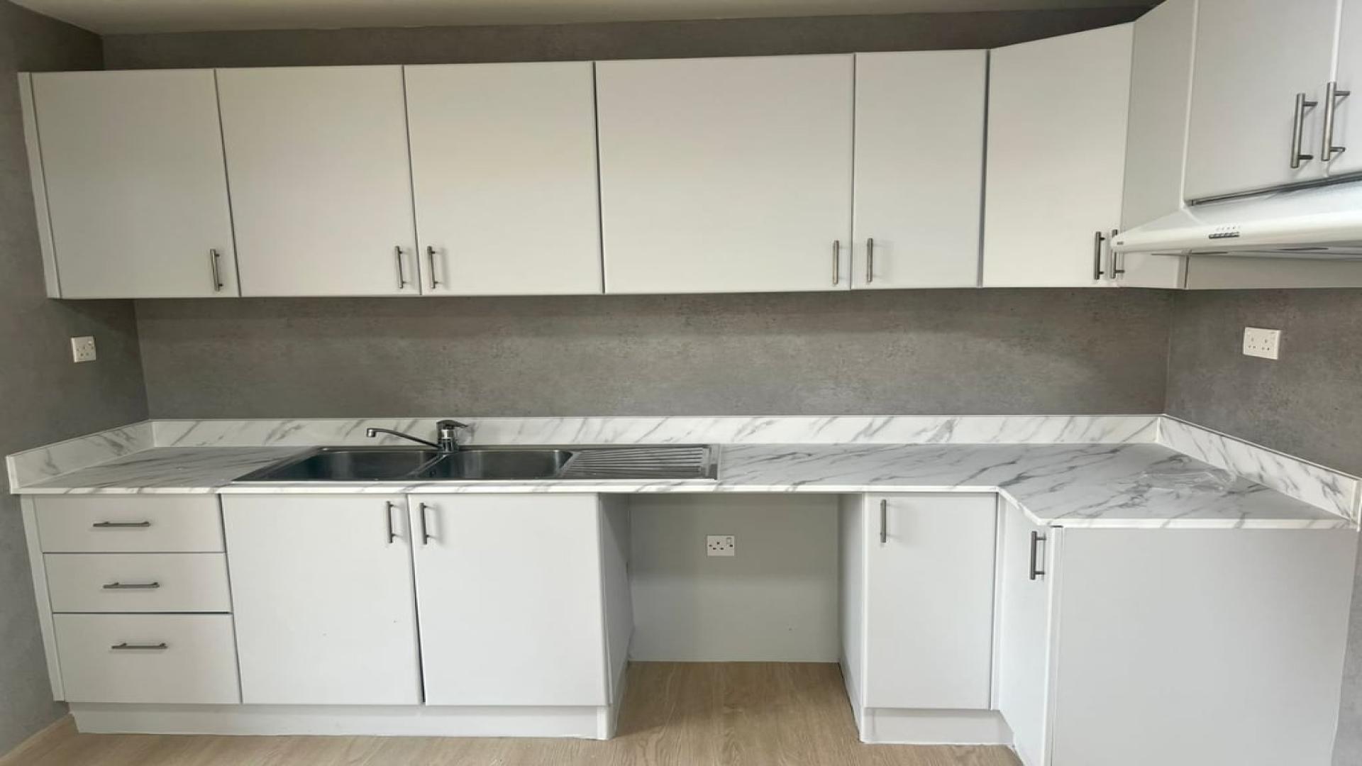 "Bright living area with garden view in upgraded 3-bedroom villa, Springs Dubai.",Upgraded kitchen in 3-bedroom villa for rent, Springs 12, Dubai. Marble countertops, modern cabinets