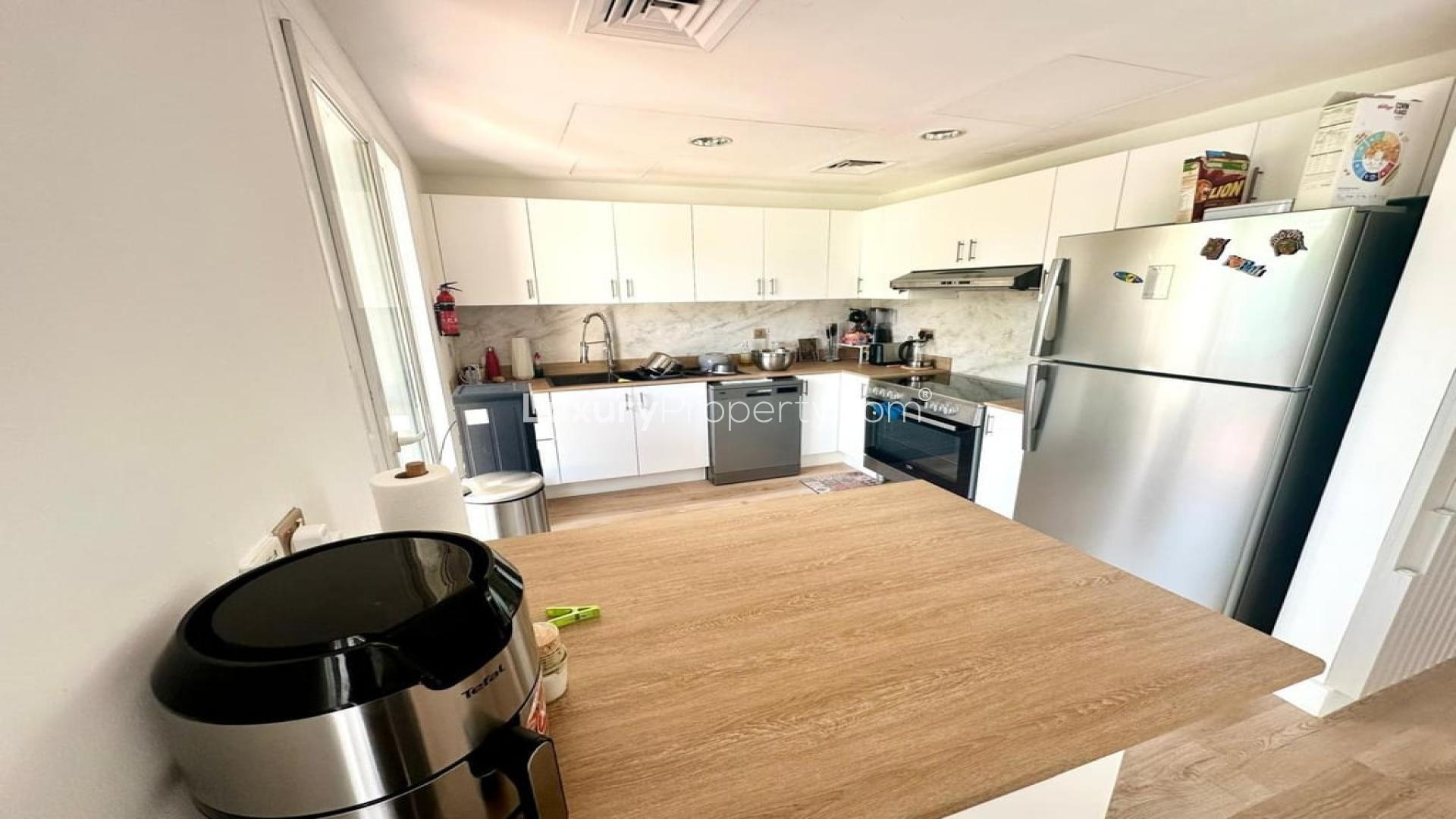 Charming living room in 3-bedroom villa, Springs 4, Dubai, with modern decor and natural light