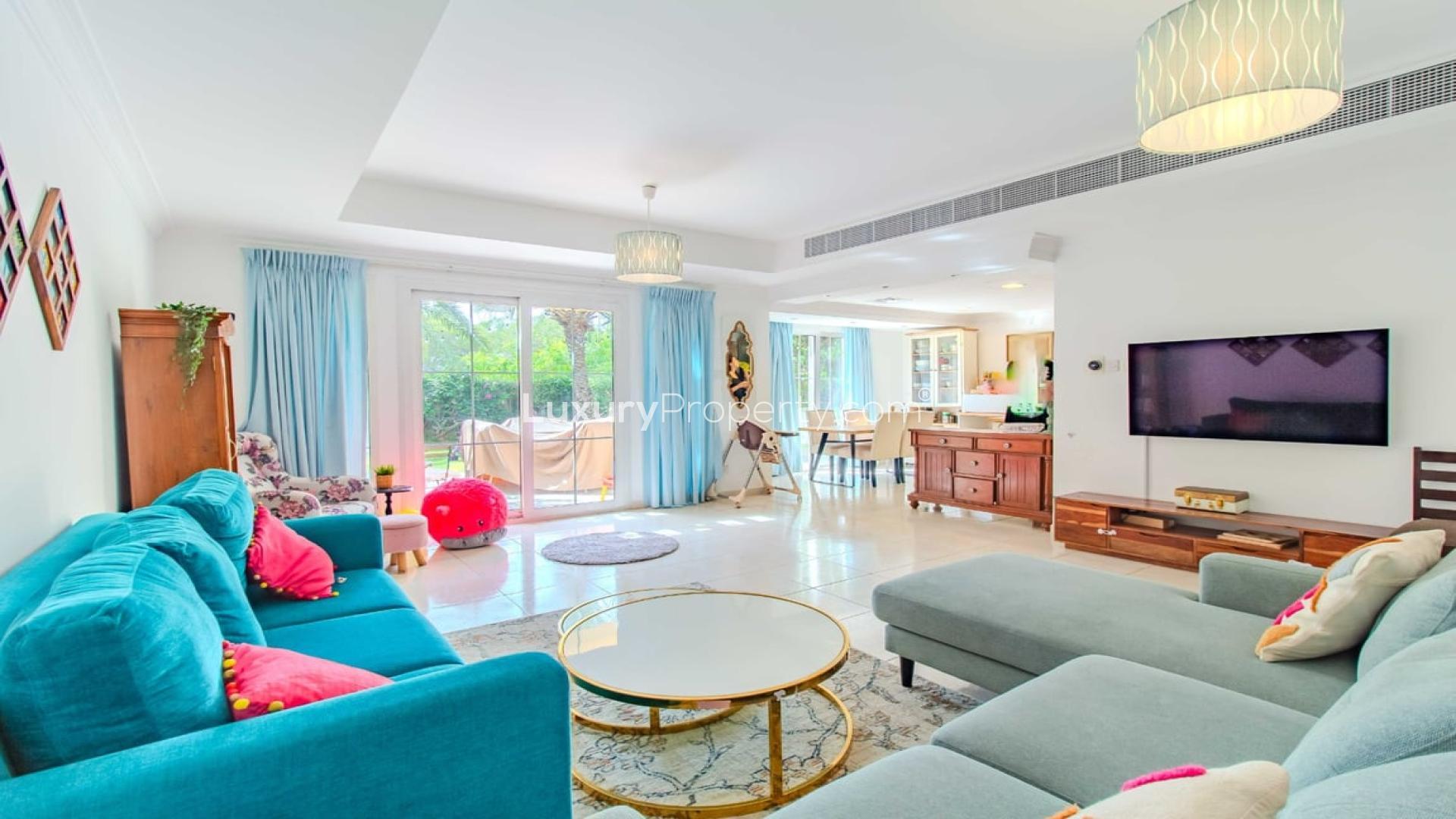 Bright living room in 3-bedroom villa for rent, Springs 12, Dubai, with garden view