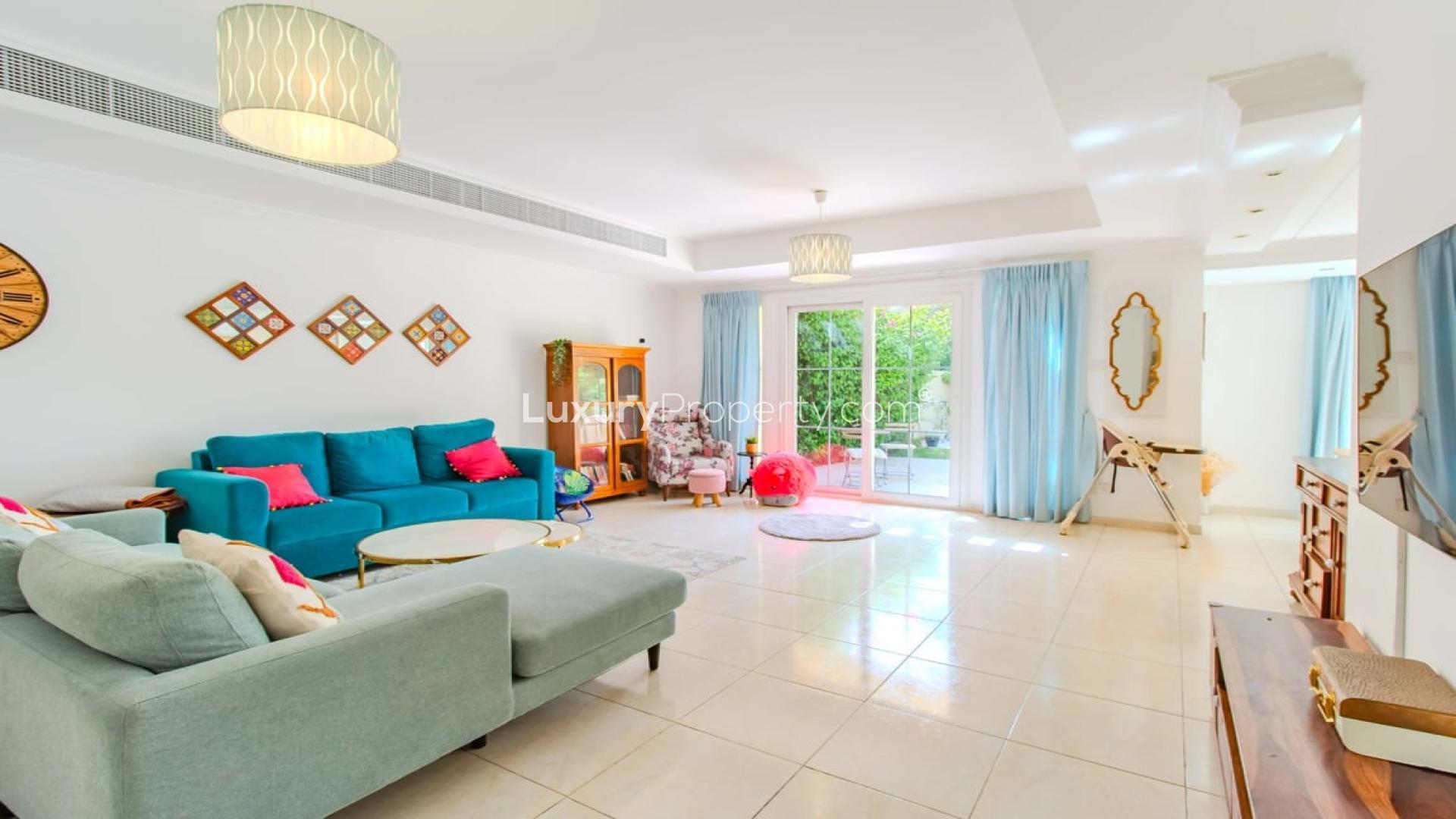 Contemporary living room in 3-bedroom villa, Springs 12, Dubai, with stylish decor and seating