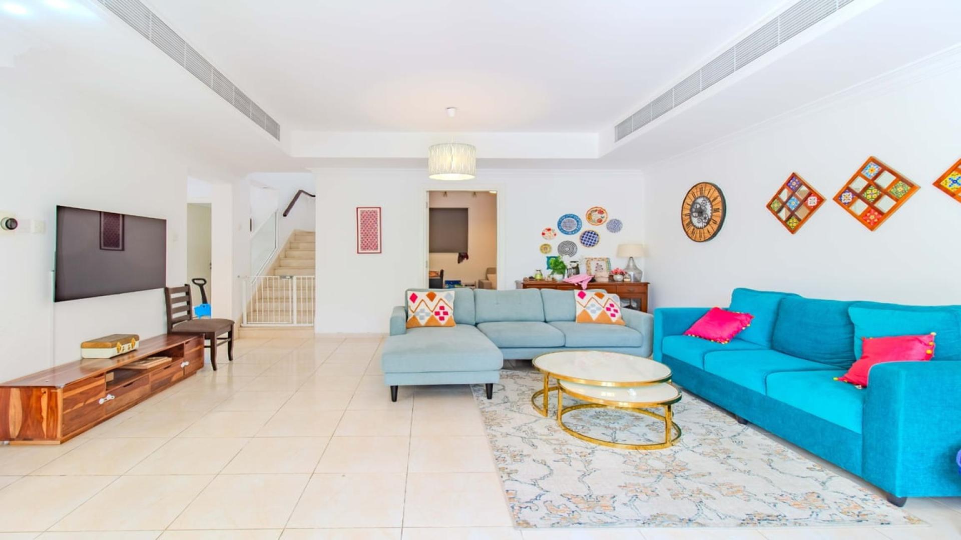 3-bedroom villa garden in Springs 12, Dubai, with patio and lush greenery