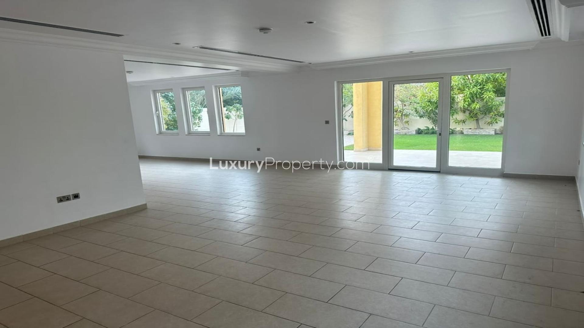 Spacious living area in Jumeirah Park Heritage villa for rent, tiled floors, bright windows