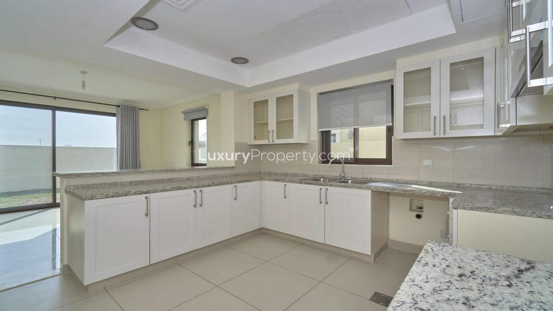 Open-plan kitchen and living area in Samara villa, Arabian Ranches 2, available for rent