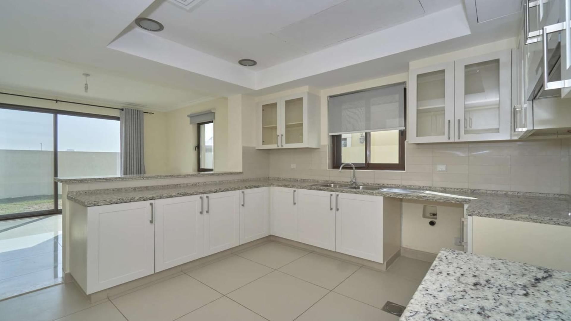 Open-plan kitchen and living area in Samara villa, Arabian Ranches 2, available for rent