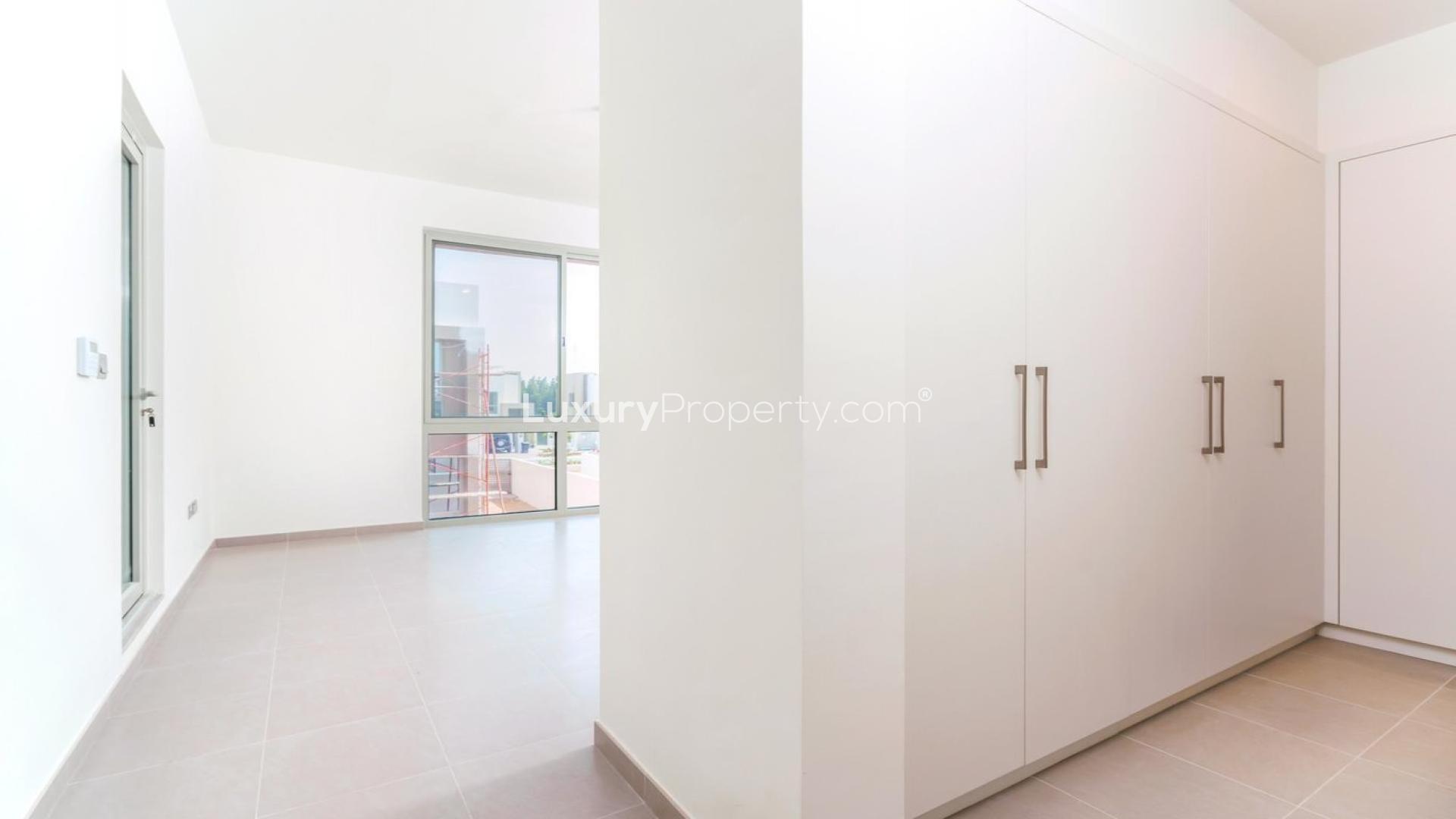 Modern kitchen in Arabian Ranches 2 villa, featuring sleek cabinetry and spacious layout