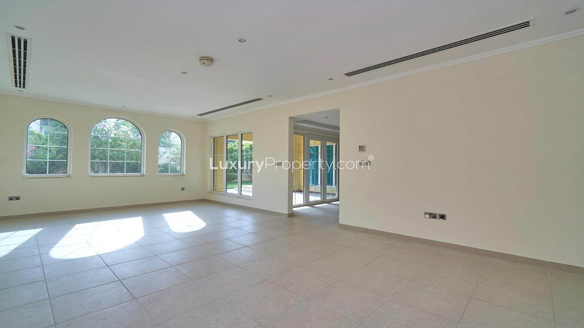 Spacious living room in Jumeirah Park villa, Legacy sub-community, with natural light and staircase