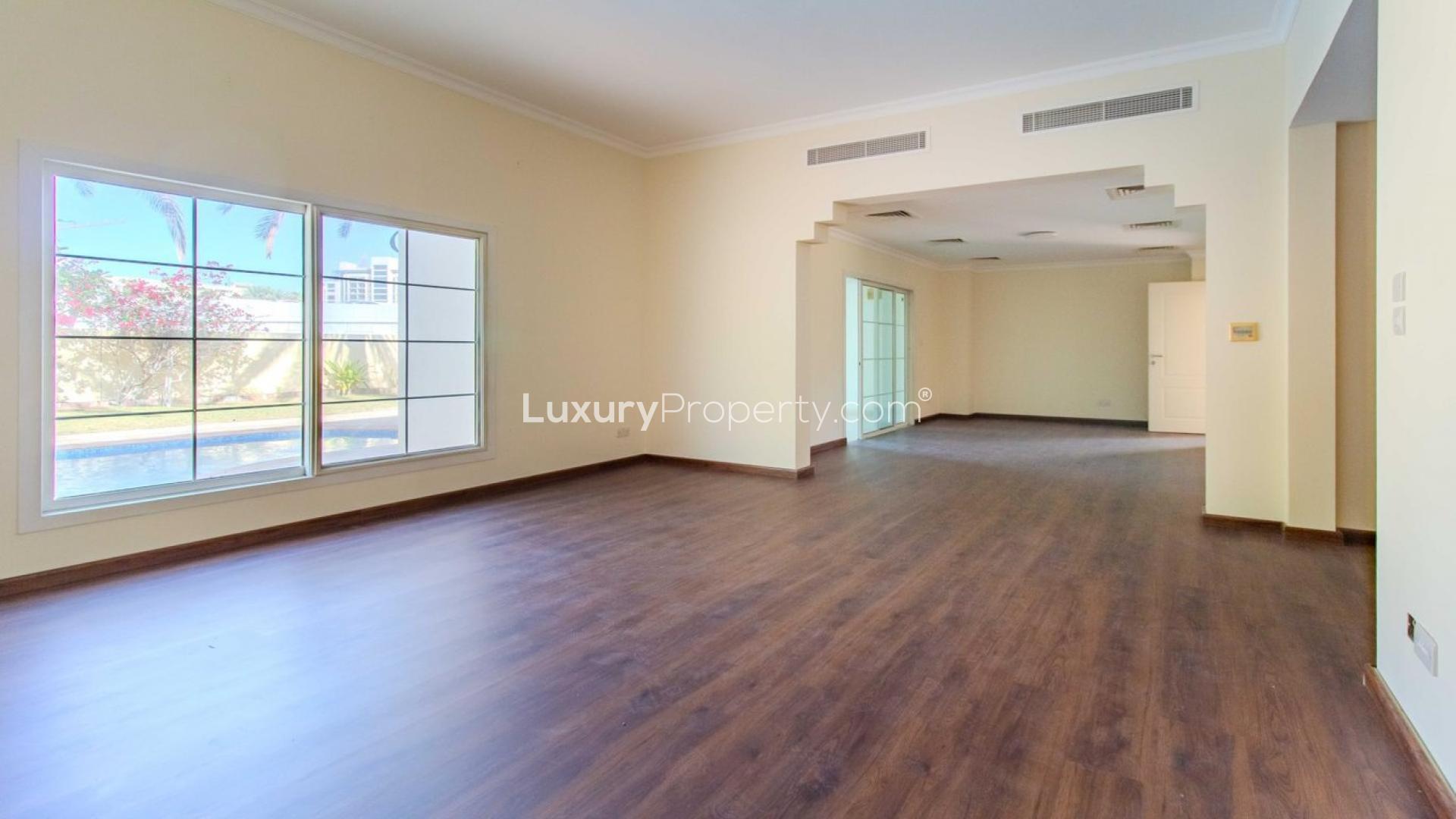 Spacious kitchen with wooden flooring in upgraded 3-bedroom villa, Meadows 1, for rent