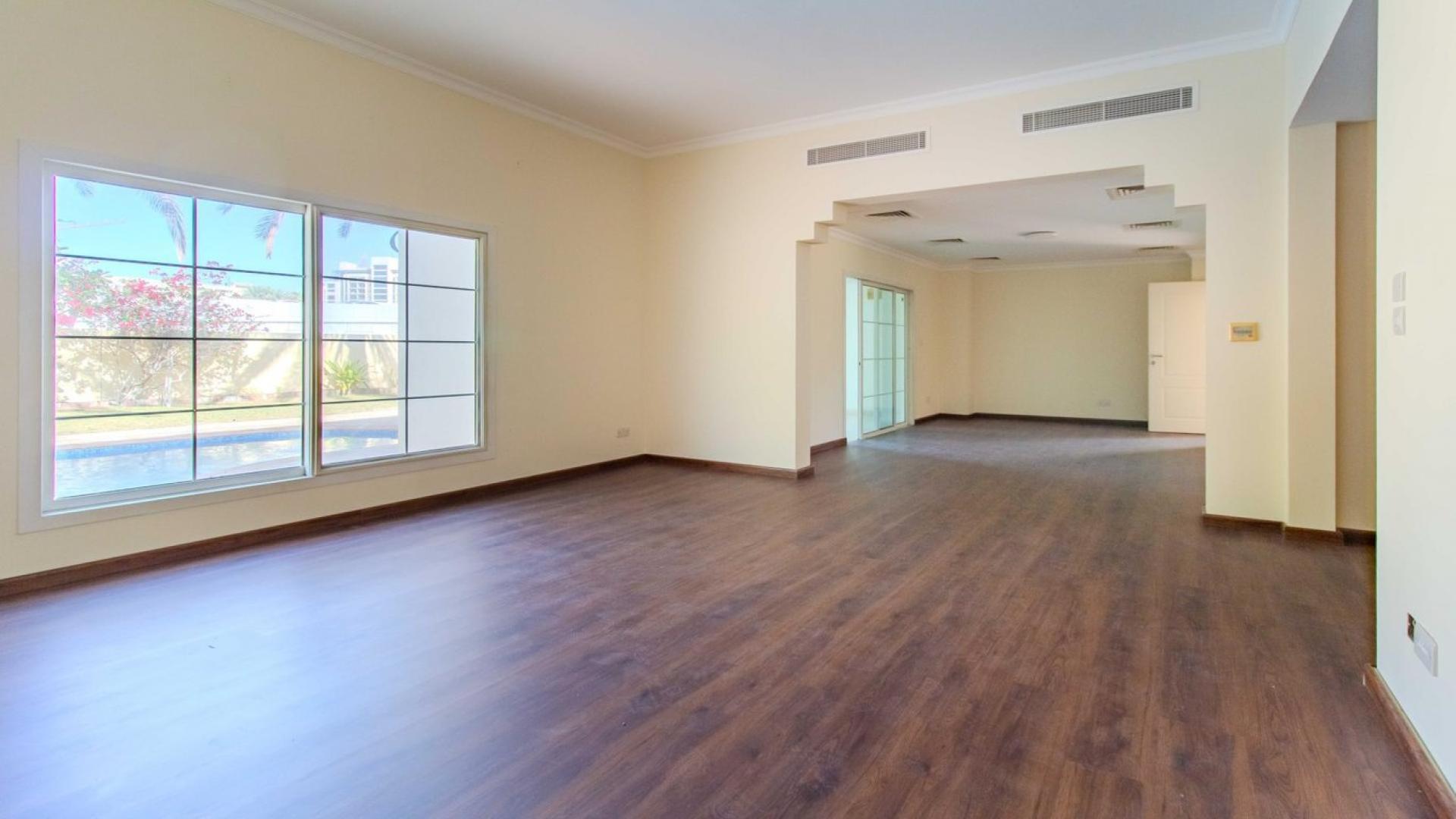 Spacious kitchen with wooden flooring in upgraded 3-bedroom villa, Meadows 1, for rent