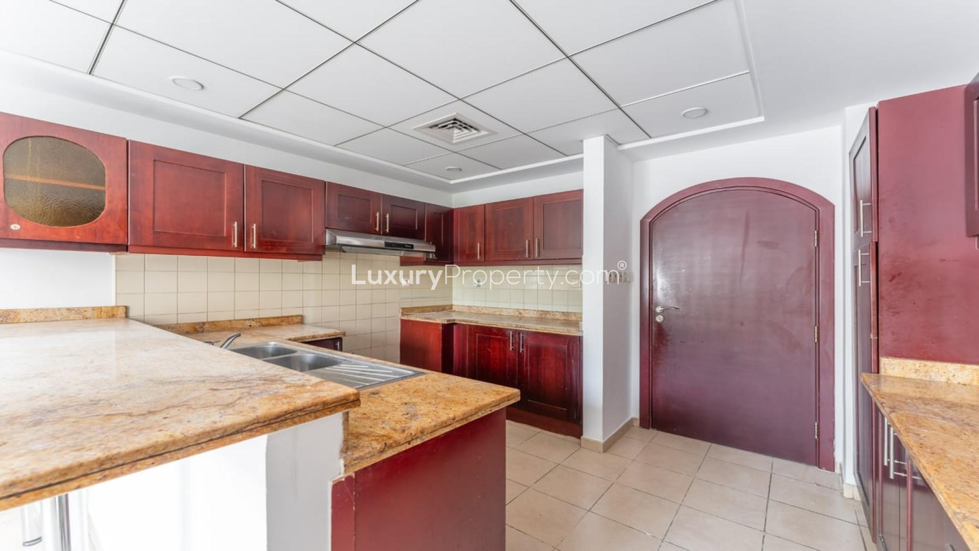 Kitchen with wooden cabinets in 3-bedroom villa, Al Reem 1, Arabian Ranches for rent