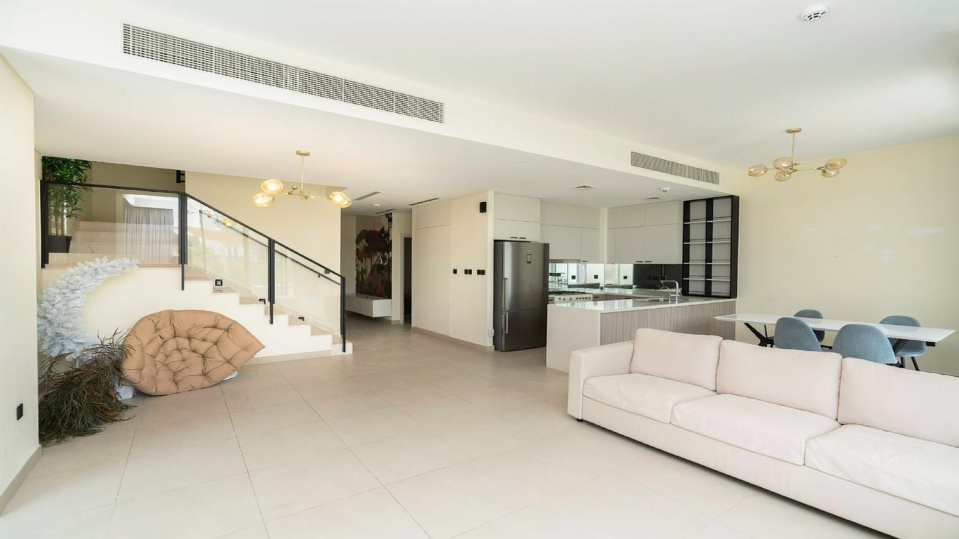 Refined 3-bed villa exterior in Golf Grove, Dubai Hills Estate, with spacious lawn