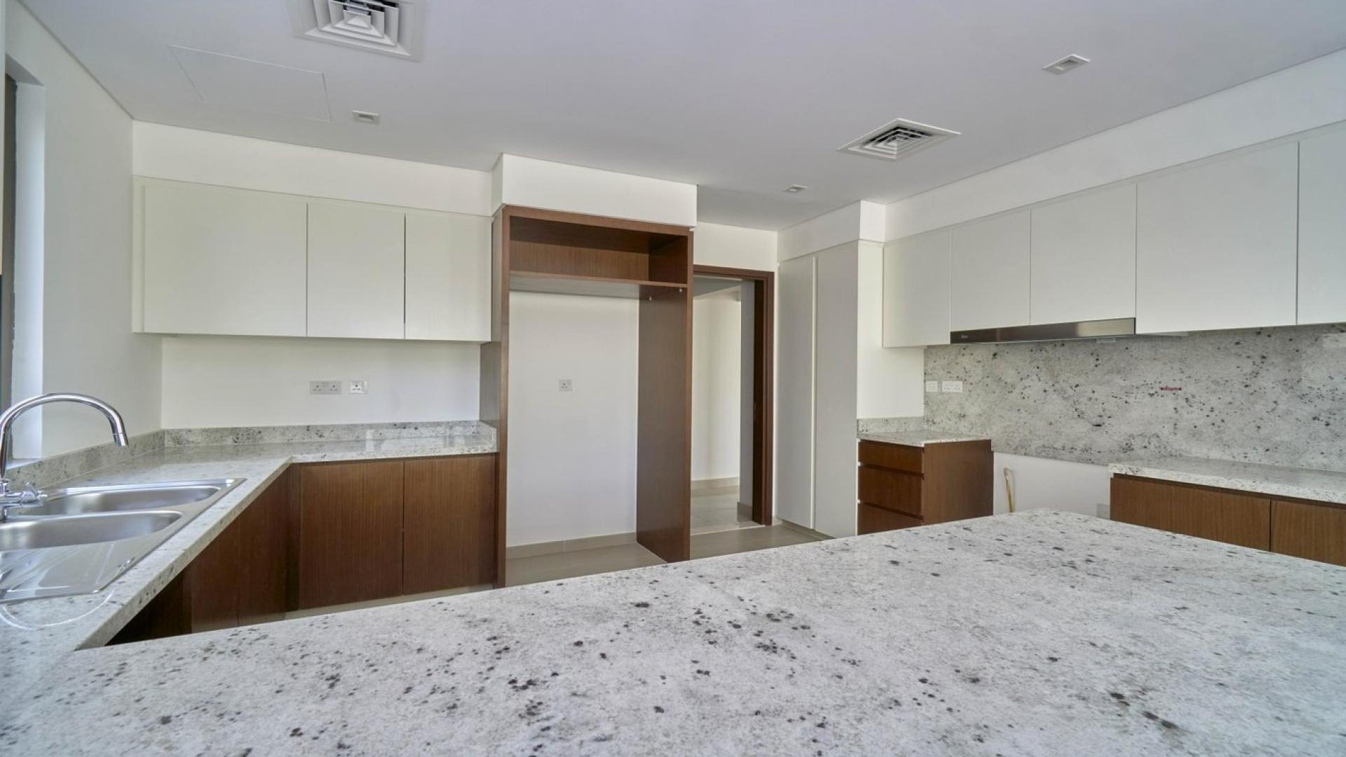 Luxurious villa interior in Azalea, Arabian Ranches 2, featuring open living space and staircase