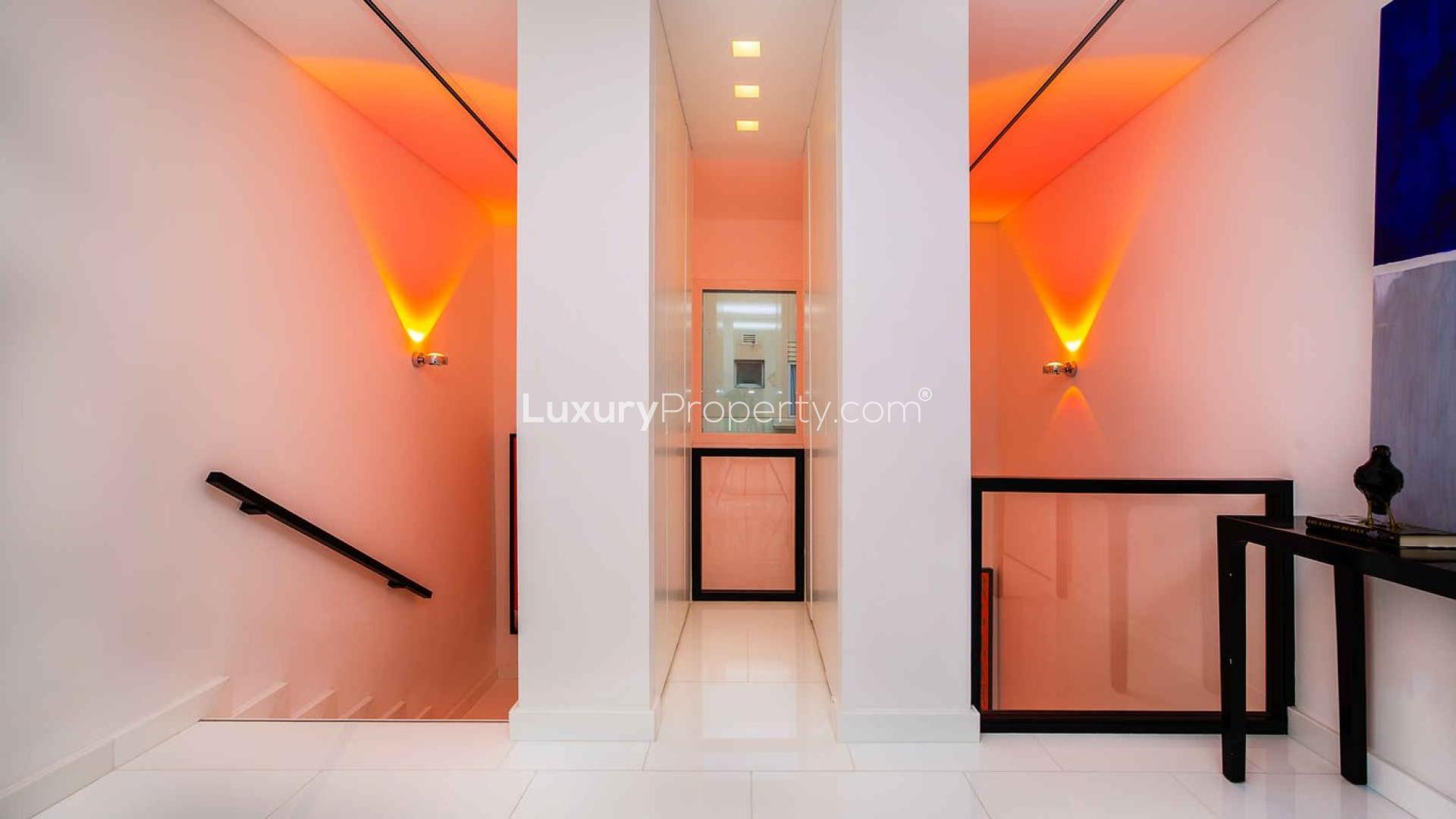 Luxurious living room in upgraded 3-bedroom villa, Meadows 9, Dubai with pool view