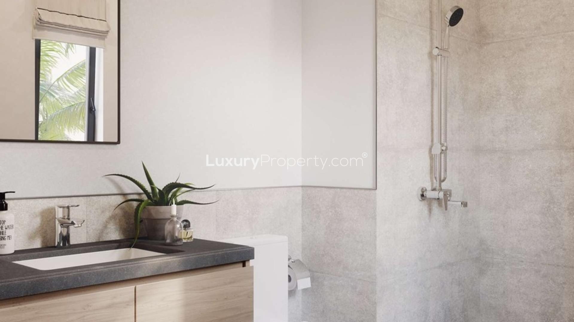 Beautiful villa community at Expo Golf Villas, Emaar South, with lush landscaping and palm trees