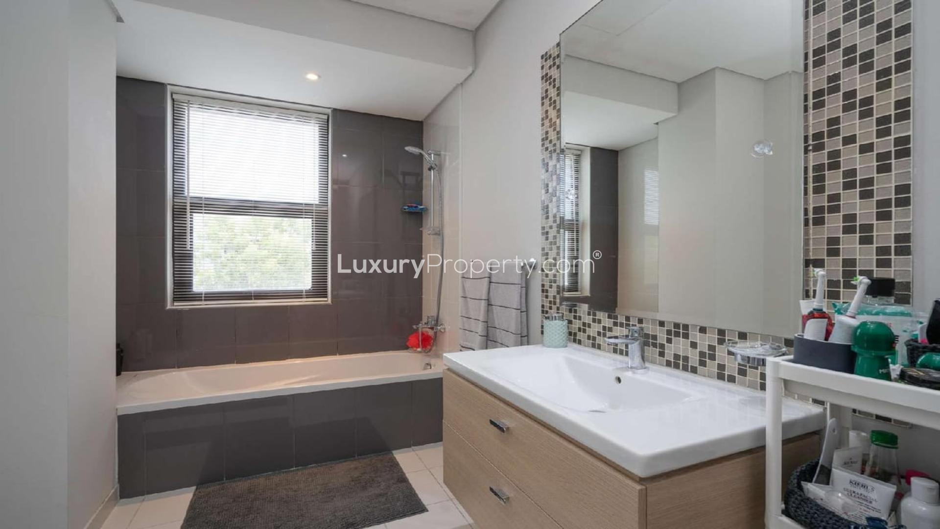 Luxurious living room in Damac Hills villa with elegant decor and large windows