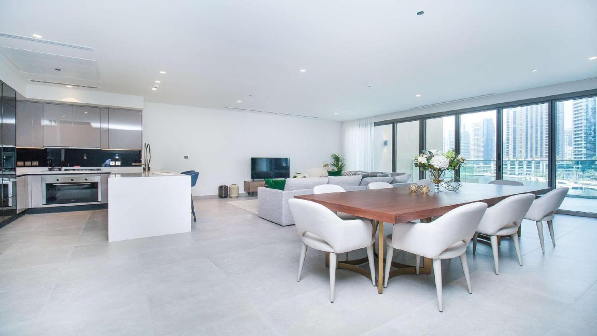 Modern open-plan living area in three-bedroom villa, Marina Gate, Dubai Marina