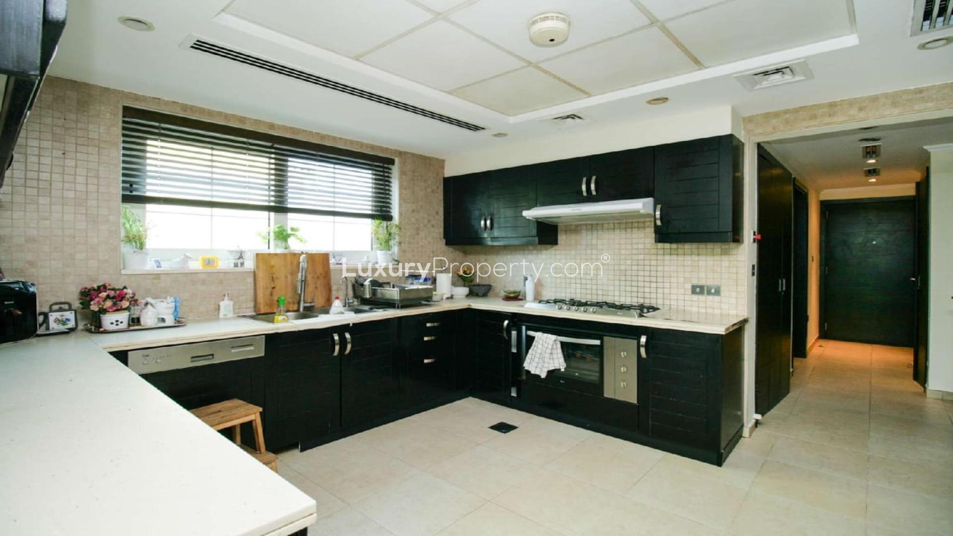 Exterior view of 3-bedroom Legacy Villa for sale in Jumeirah Park, lush garden entrance