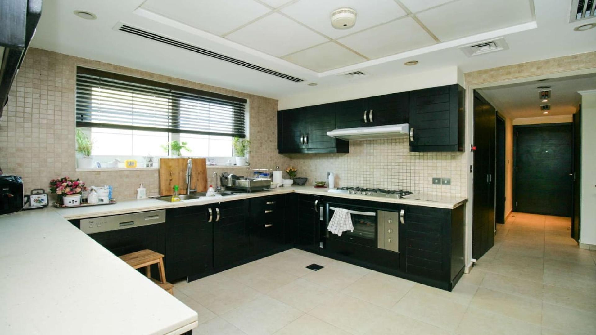 Exterior view of 3-bedroom Legacy Villa for sale in Jumeirah Park, lush garden entrance