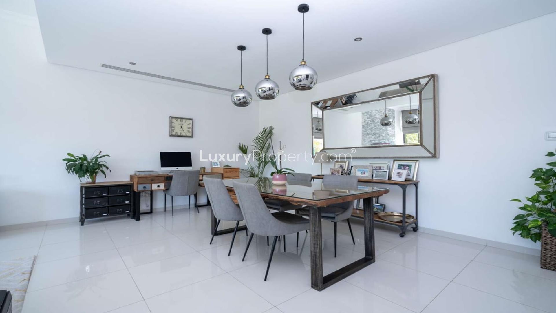 Modern living and dining area in upgraded Silver Springs villa, Damac Hills, for sale