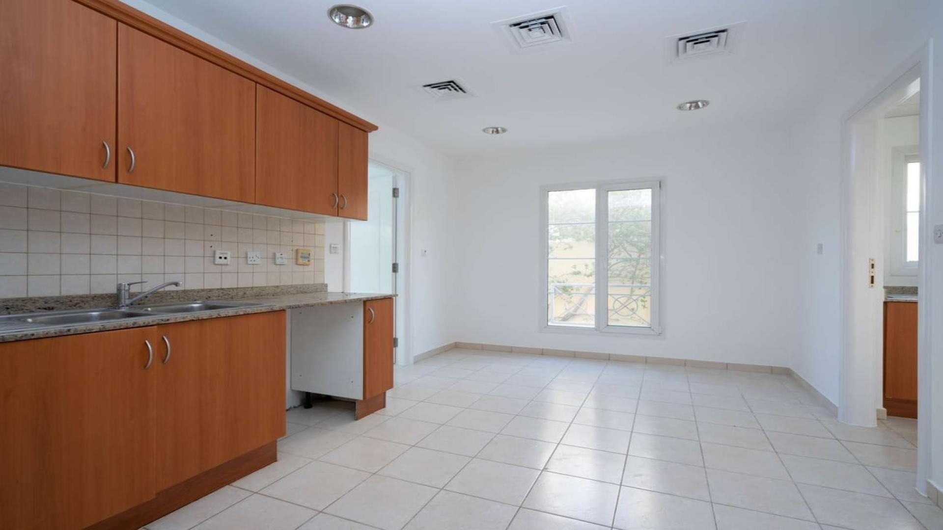 Manicured garden view of a 3-bedroom villa in Meadows 9, for sale