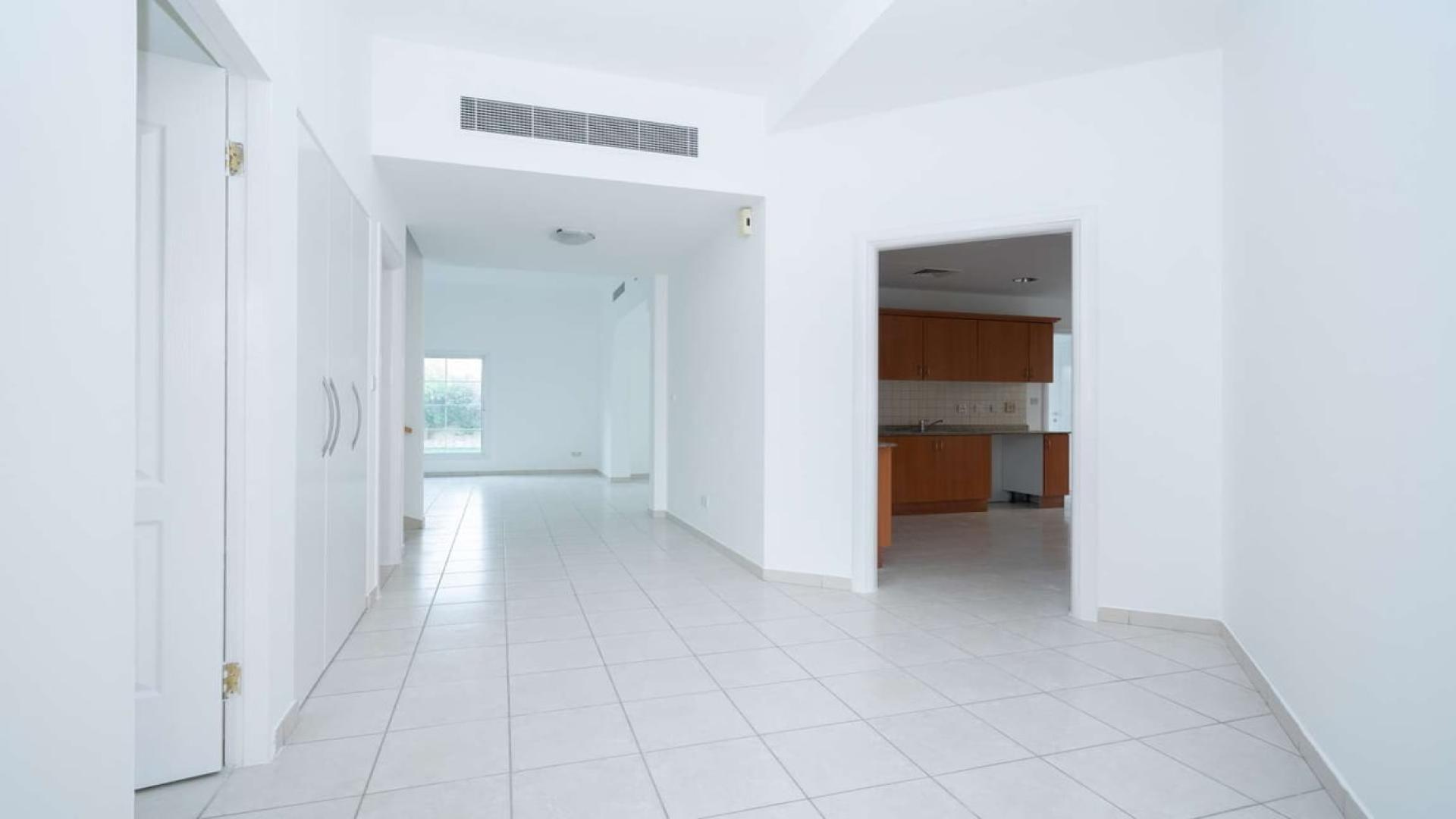 Empty room with tiled floor and two windows in Meadows 9 villa for sale