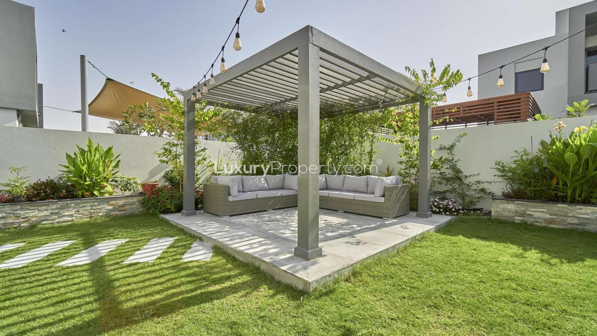 Front entrance of a three-bedroom villa in Sidra, Dubai Hills Estate, with landscaped garden