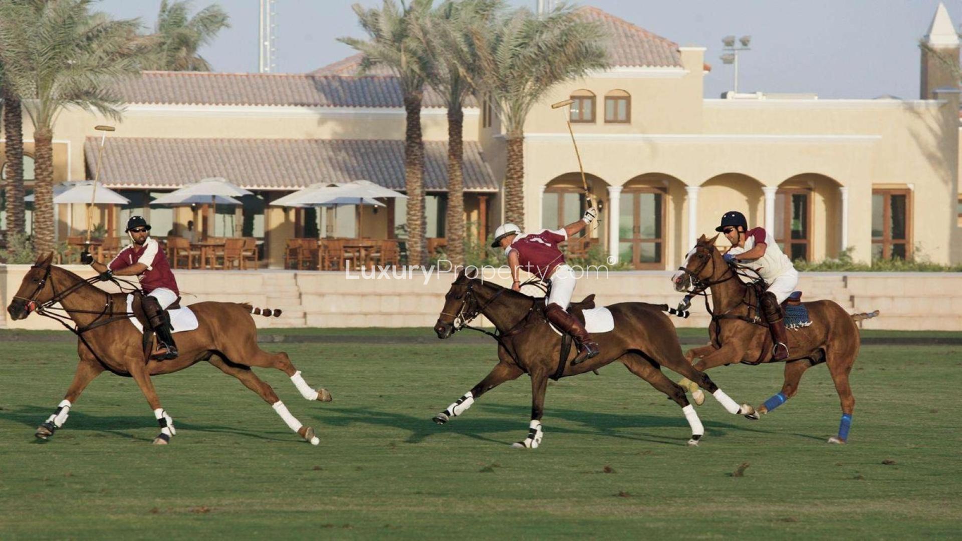 Modern living room in Camelia townhouse, Arabian Ranches 2, featuring elegant decor and garden view