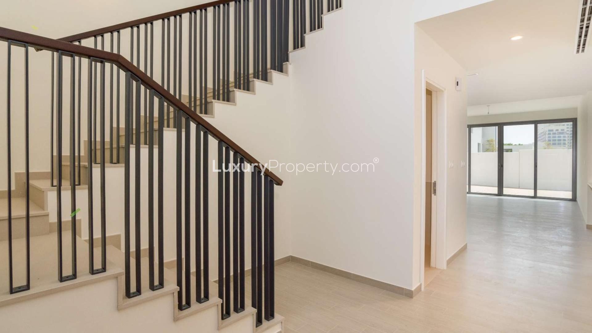 Outdoor pool area with sun loungers at stunning independent family villa for sale