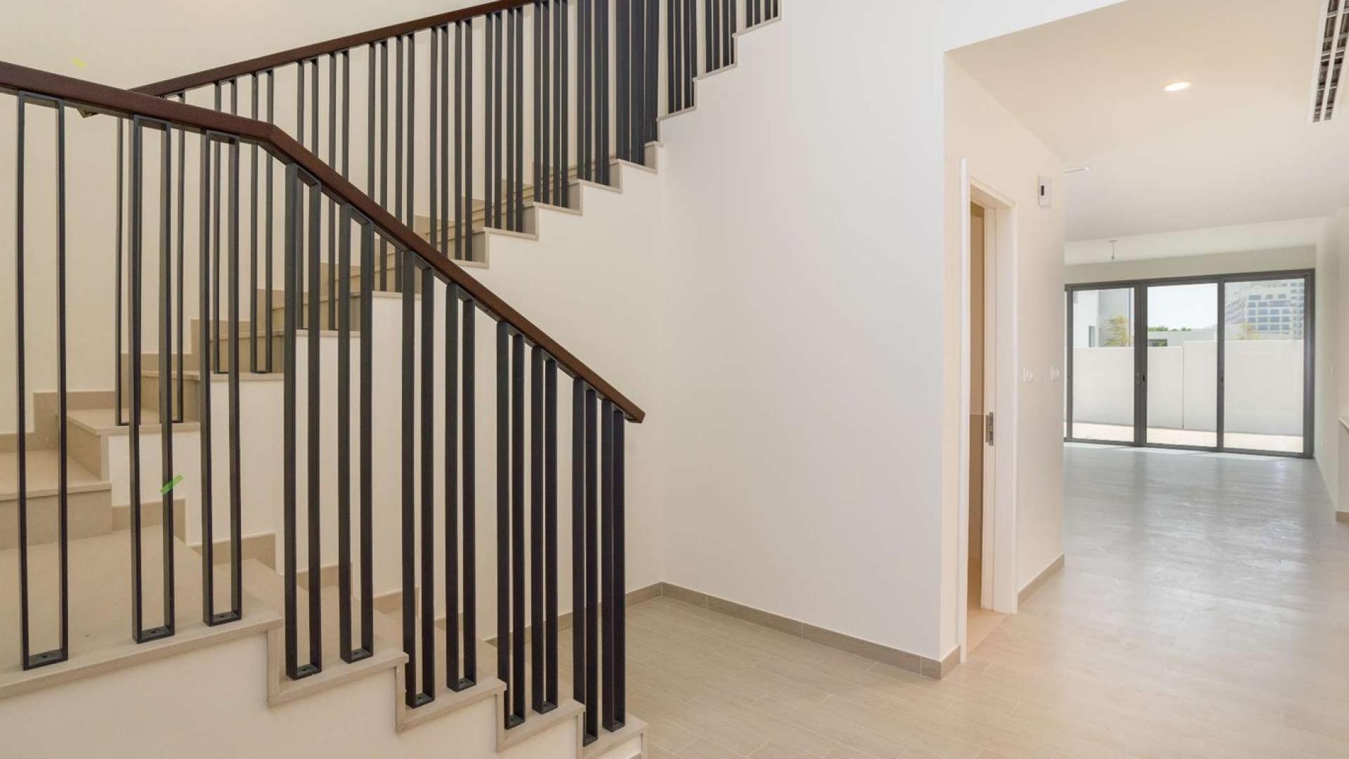 Outdoor pool area with sun loungers at stunning independent family villa for sale