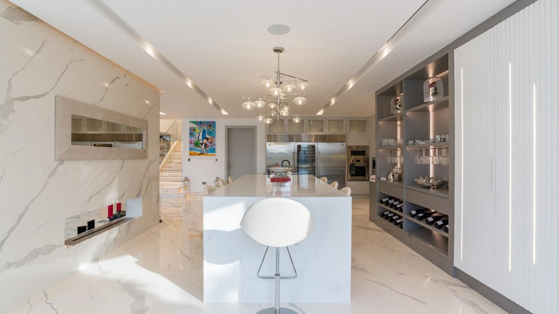 Luxurious open-plan living area with marble floors in Palm Jumeirah Garden Home villa