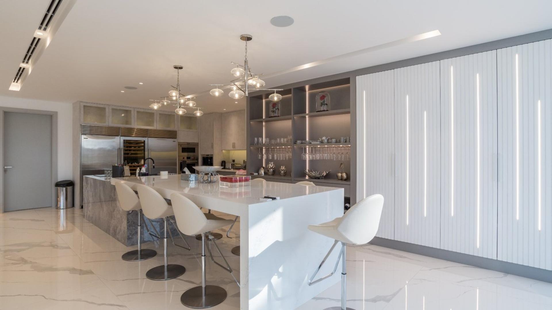 Luxurious living room in 3-bedroom villa, Palm Jumeirah, with modern decor and waterfront views