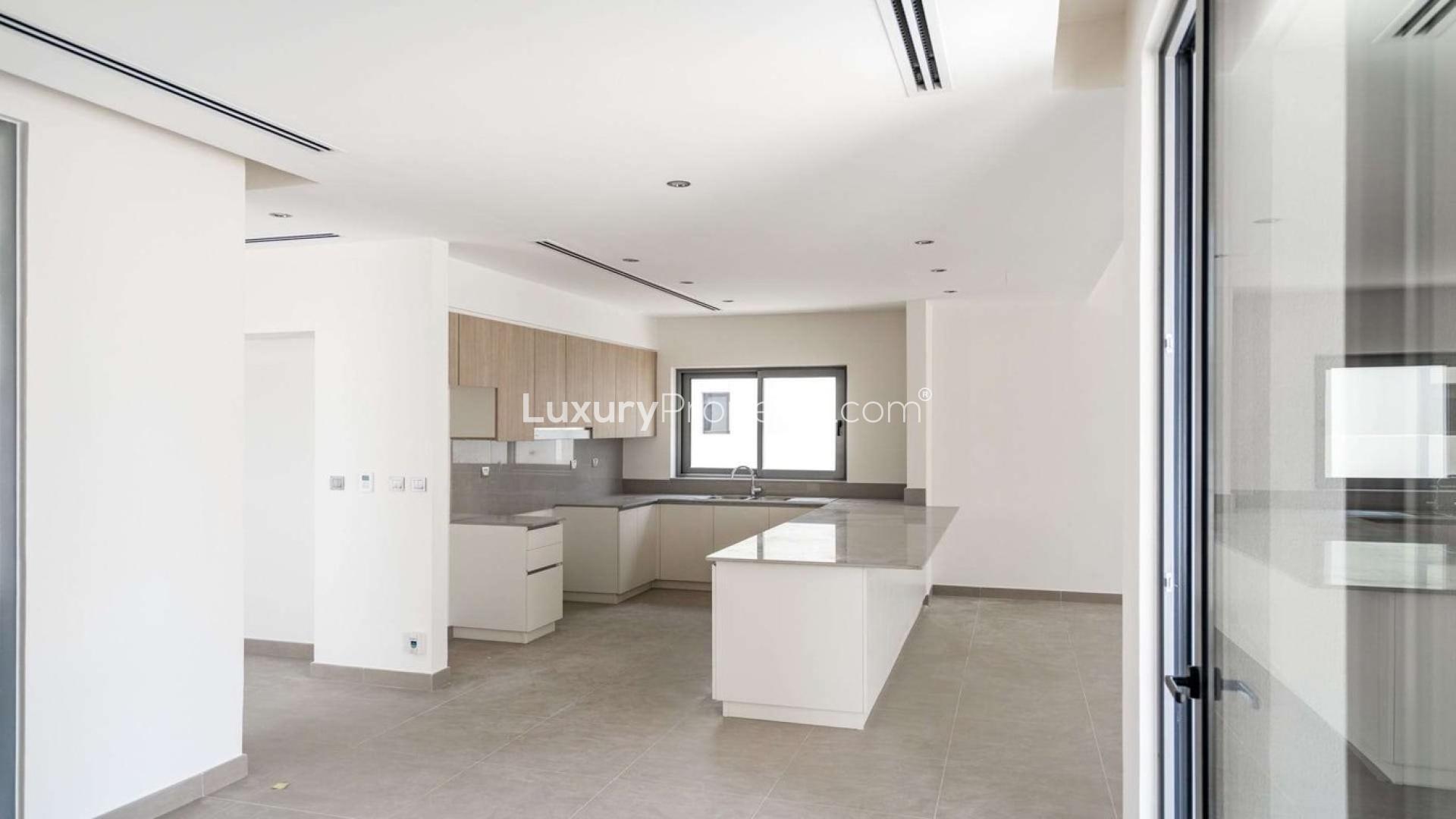 Modern kitchen in Sidra 3 Villa, Dubai Hills Estate, featuring sleek countertops and cabinetry