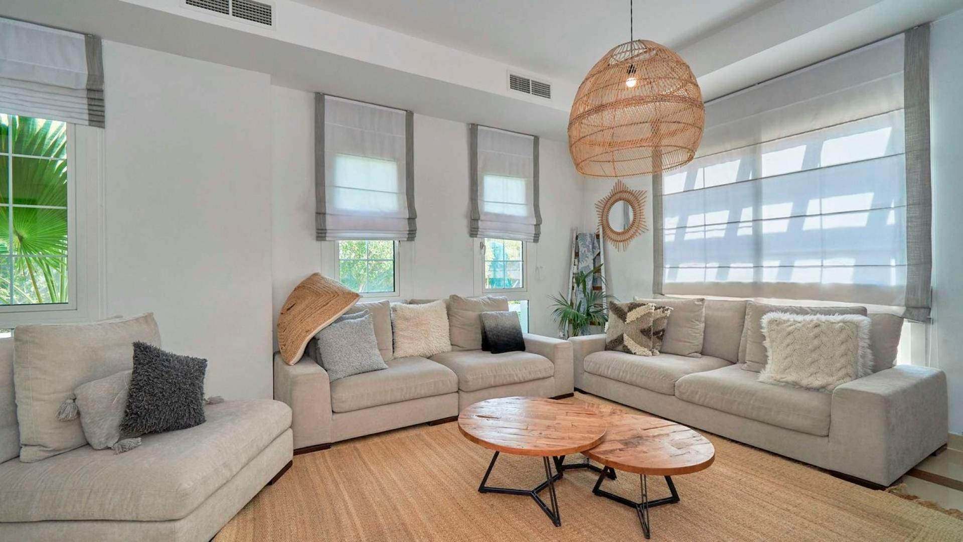 Bright living room in upgraded Rahat villa, Mudon, with modern decor and natural light