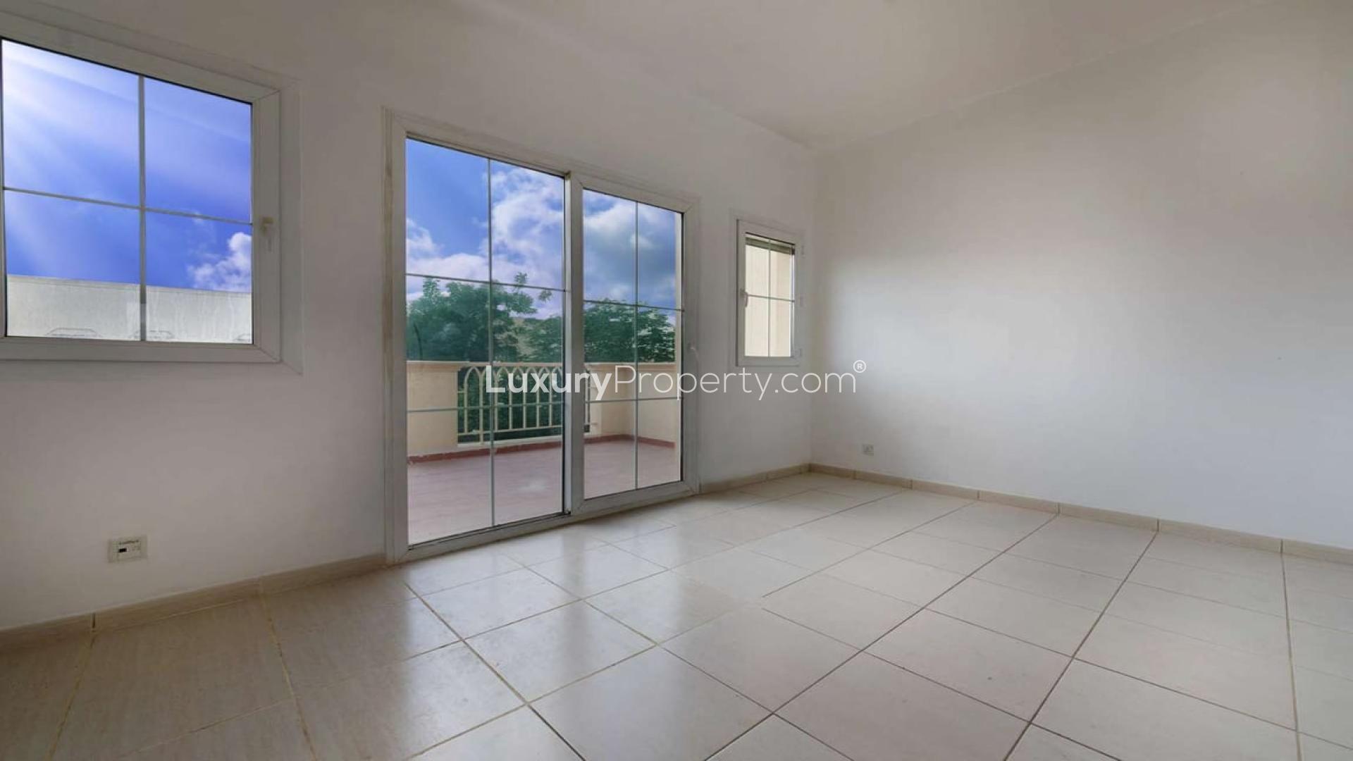 Bright interior of villa in The Springs with garden view through large windows