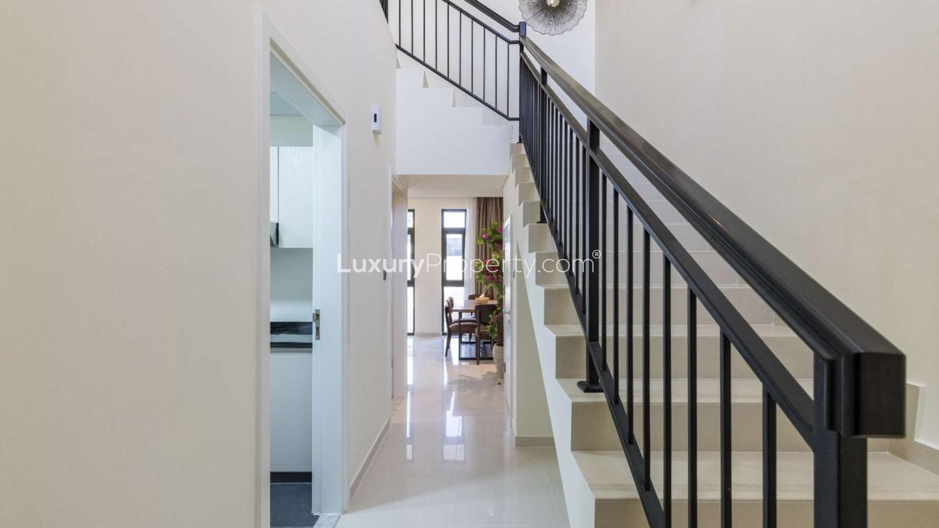 Furnished living and dining area in 3-bedroom townhouse, Zinnia, Damac Hills 2, spacious layout