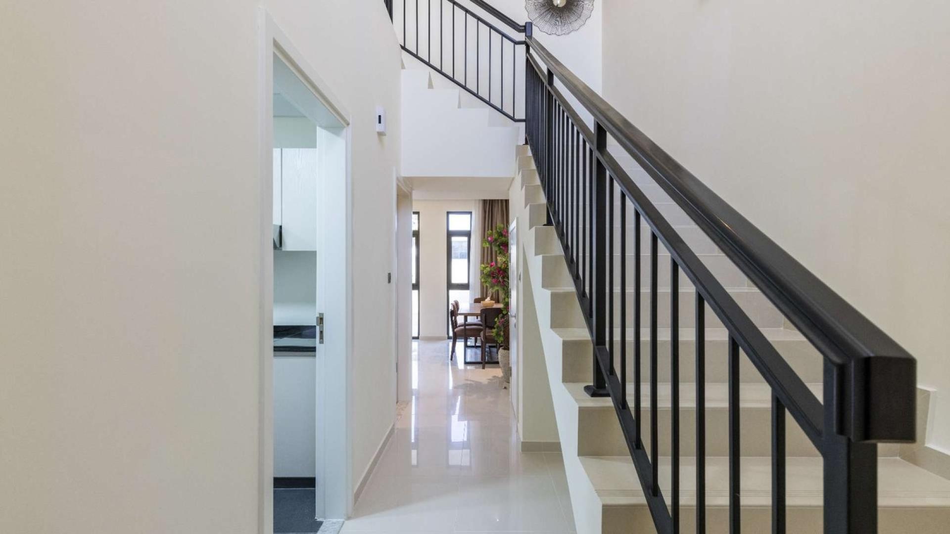 Furnished living and dining area in 3-bedroom townhouse, Zinnia, Damac Hills 2, spacious layout