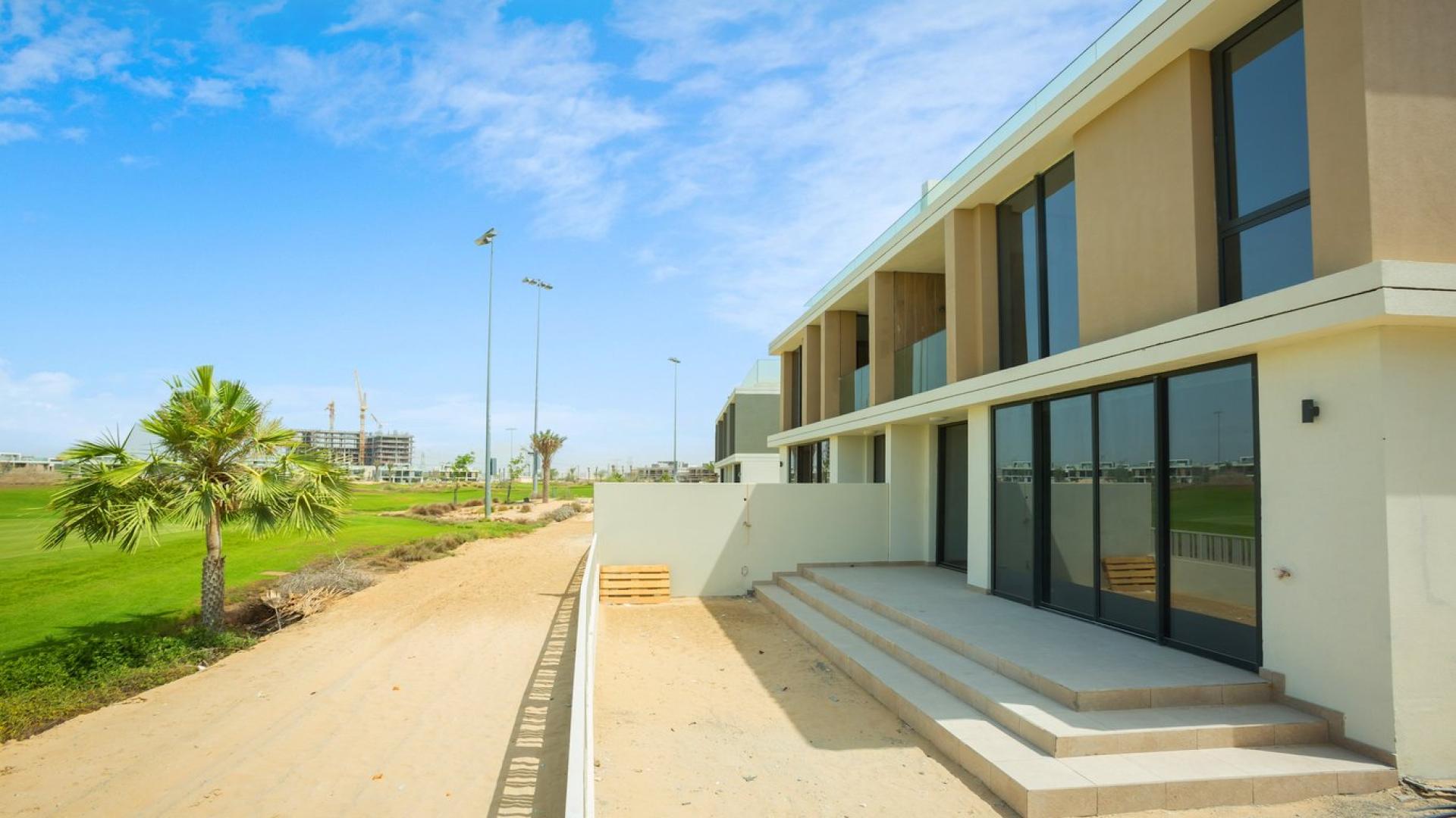 Modern three-bedroom villa exterior in Club Villas, Dubai Hills Estate, lush surroundings