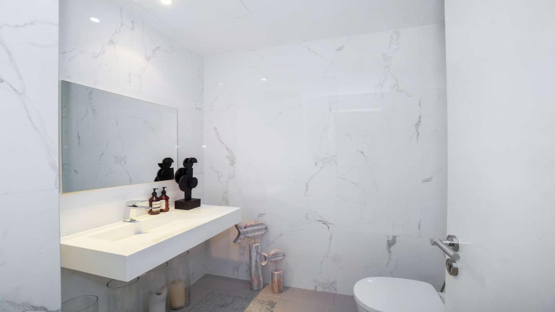 Modern bathroom in elegant THK Villa, Flora, Damac Hills, with sleek marble design