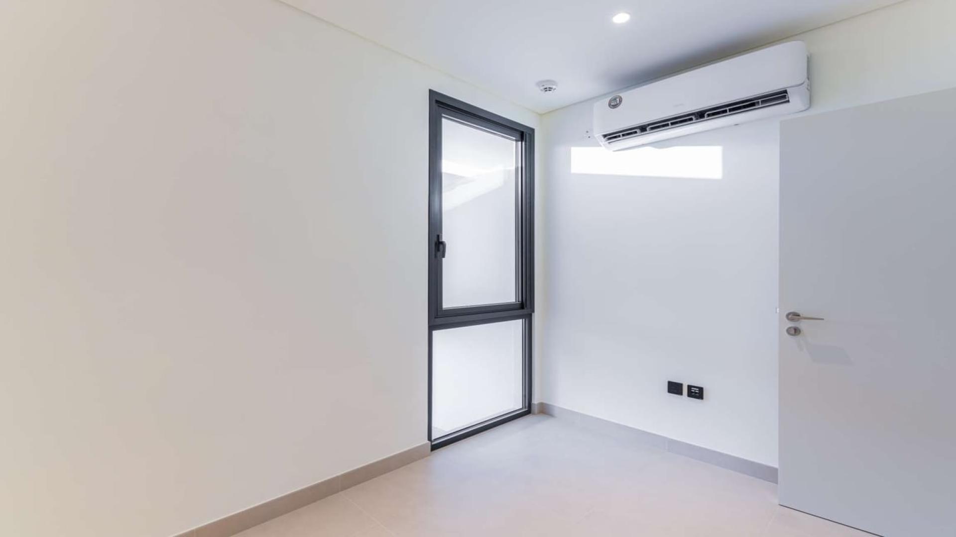 Bright room with window and AC in Dubai Hills Estate villa, Golf Grove