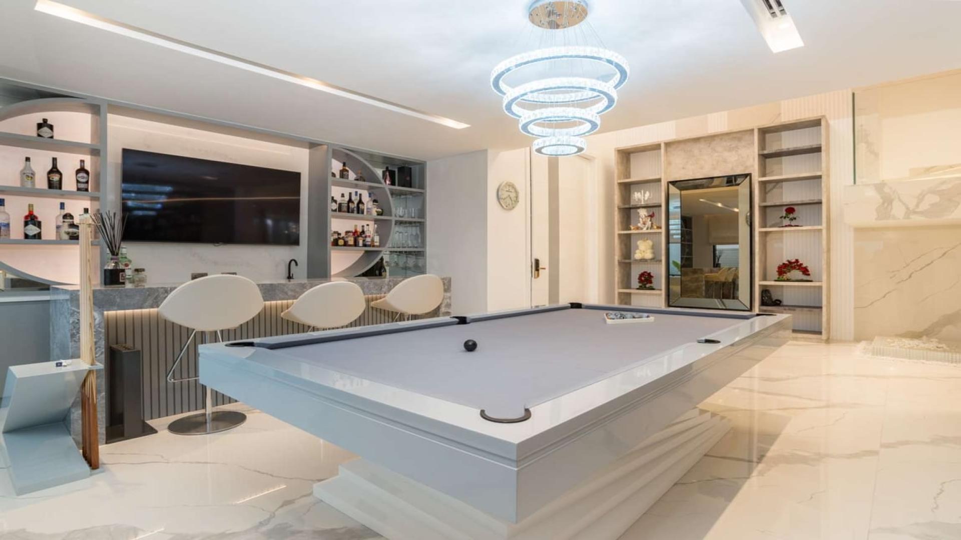 Luxury billiard room with modern bar in Palm Jumeirah villa, Garden Homes