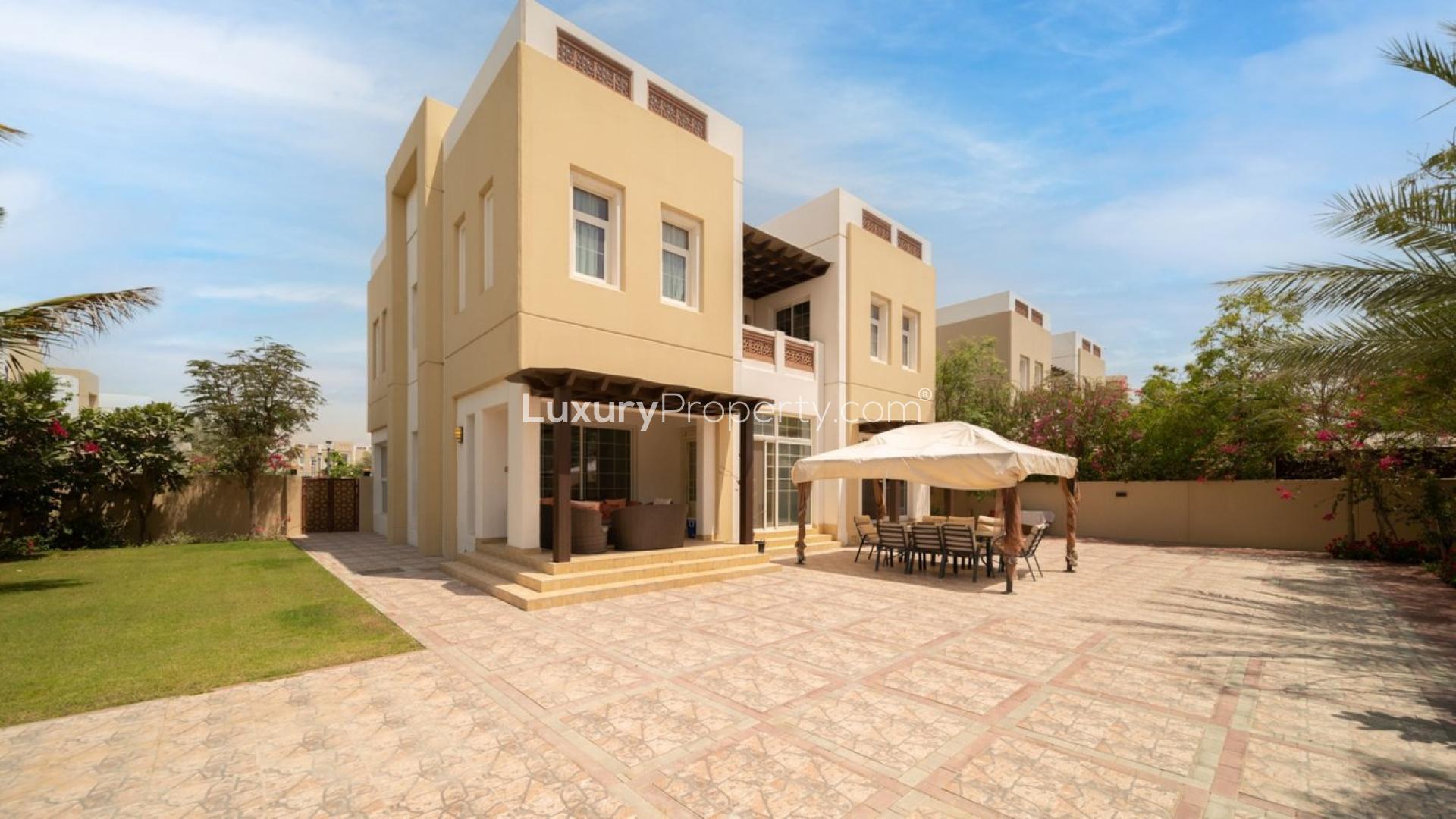 Spacious villa exterior with patio and garden in Rahat, Mudon community, Dubai