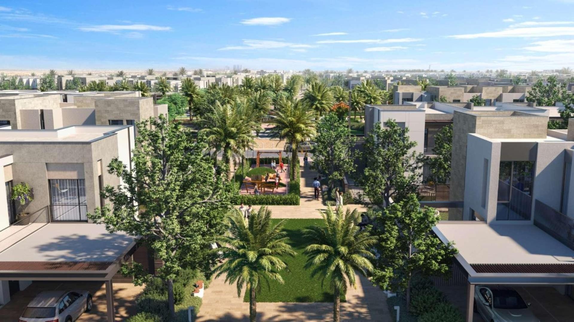 Luxurious bedroom in Arabian Ranches 3 villa with balcony view, modern decor, and natural light