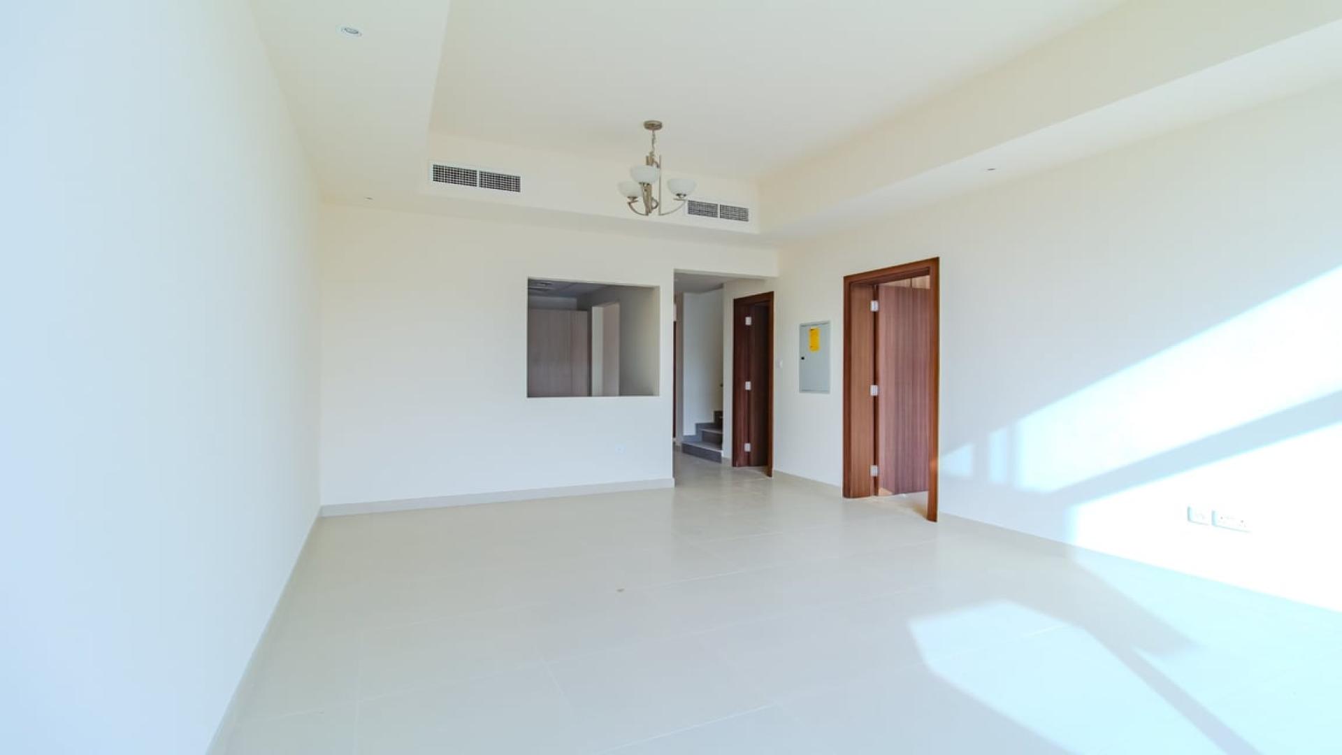 Spacious living area with high ceilings in District 11 villa, Mohammed Bin Rashid City
