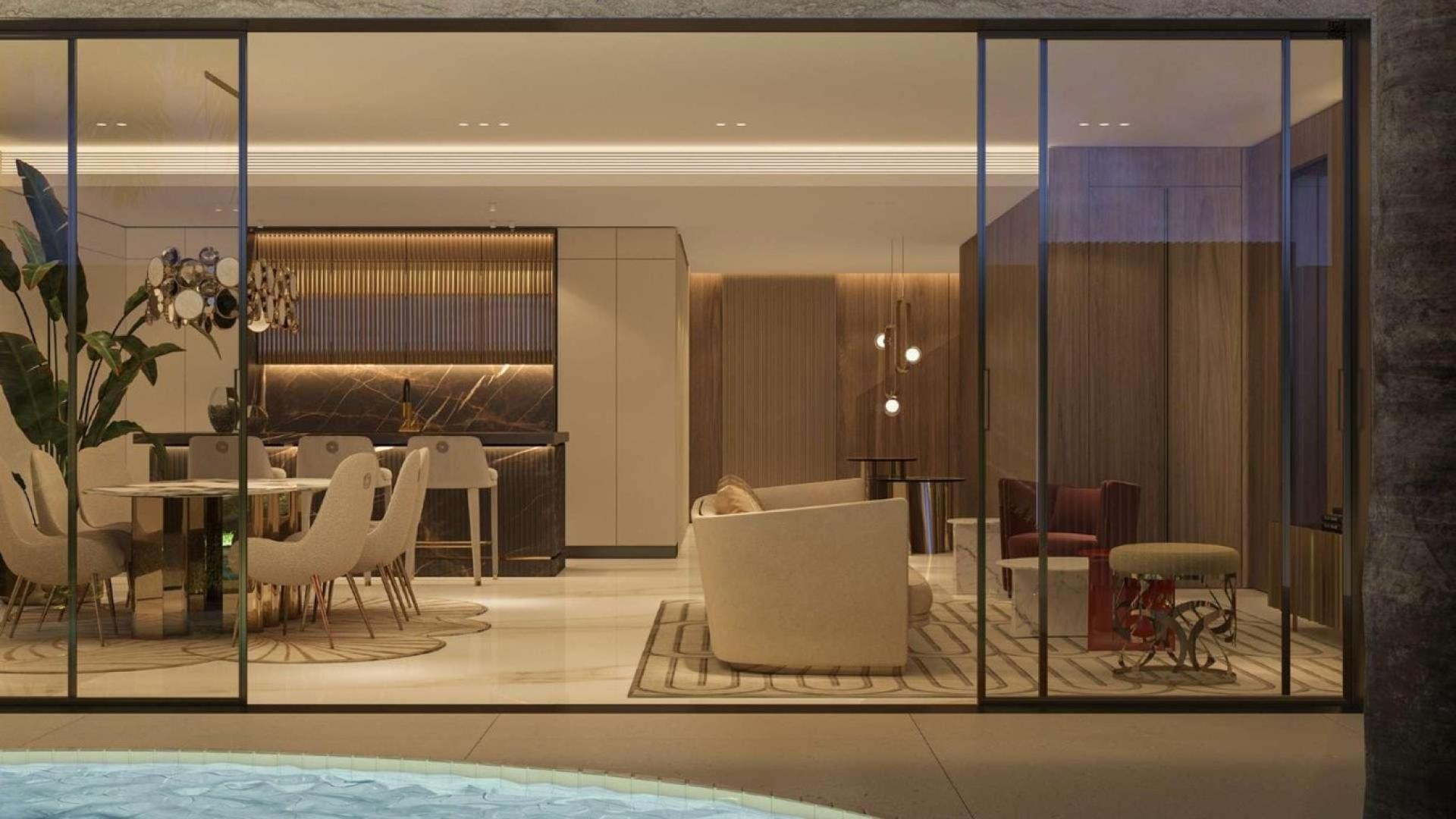 Luxurious open-plan living room and dining area in Jasmine Lane villa, Jumeirah Golf Estates