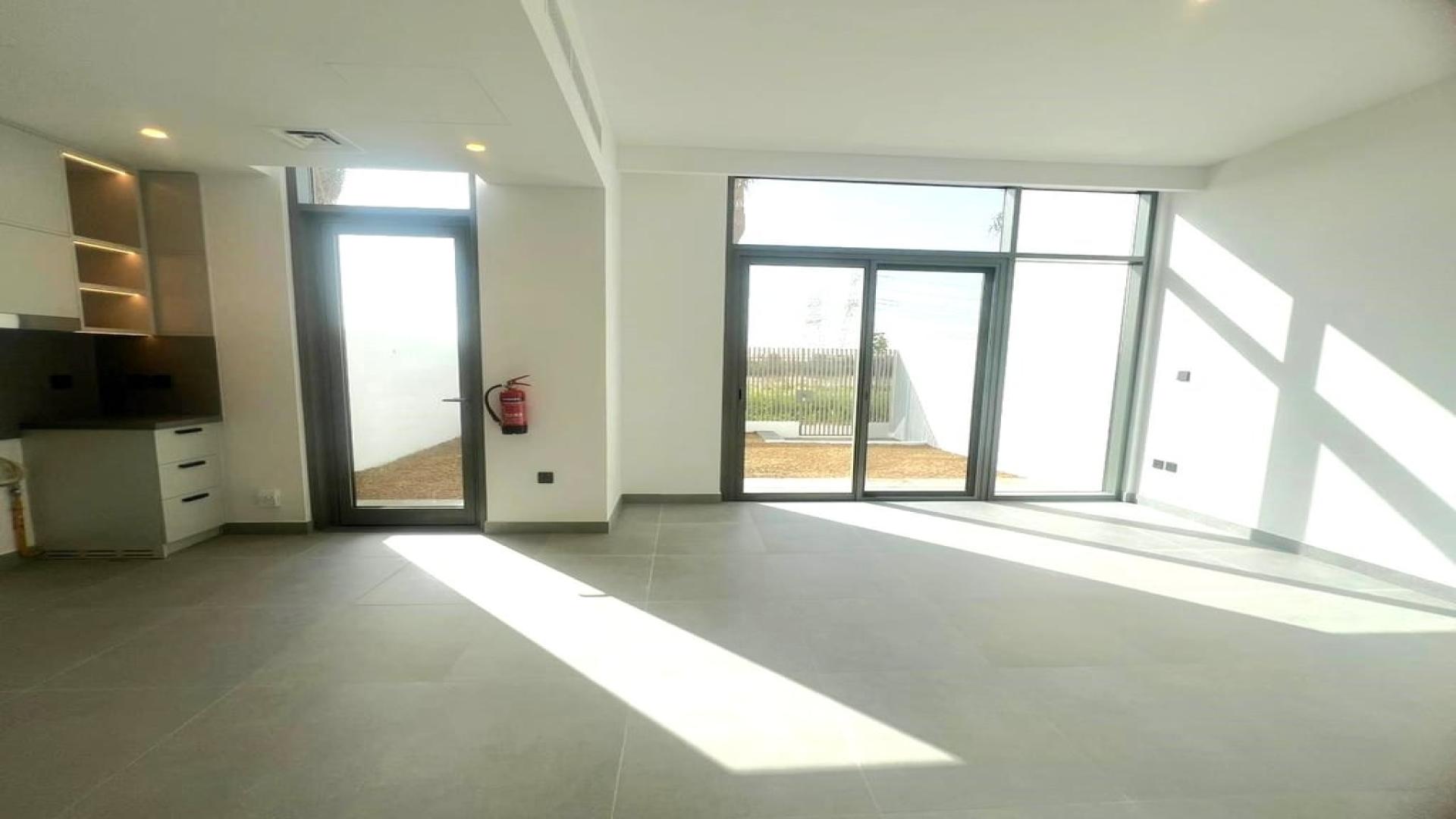 Bright living area in 3-bedroom villa, Ruba, Arabian Ranches 3, with garden view