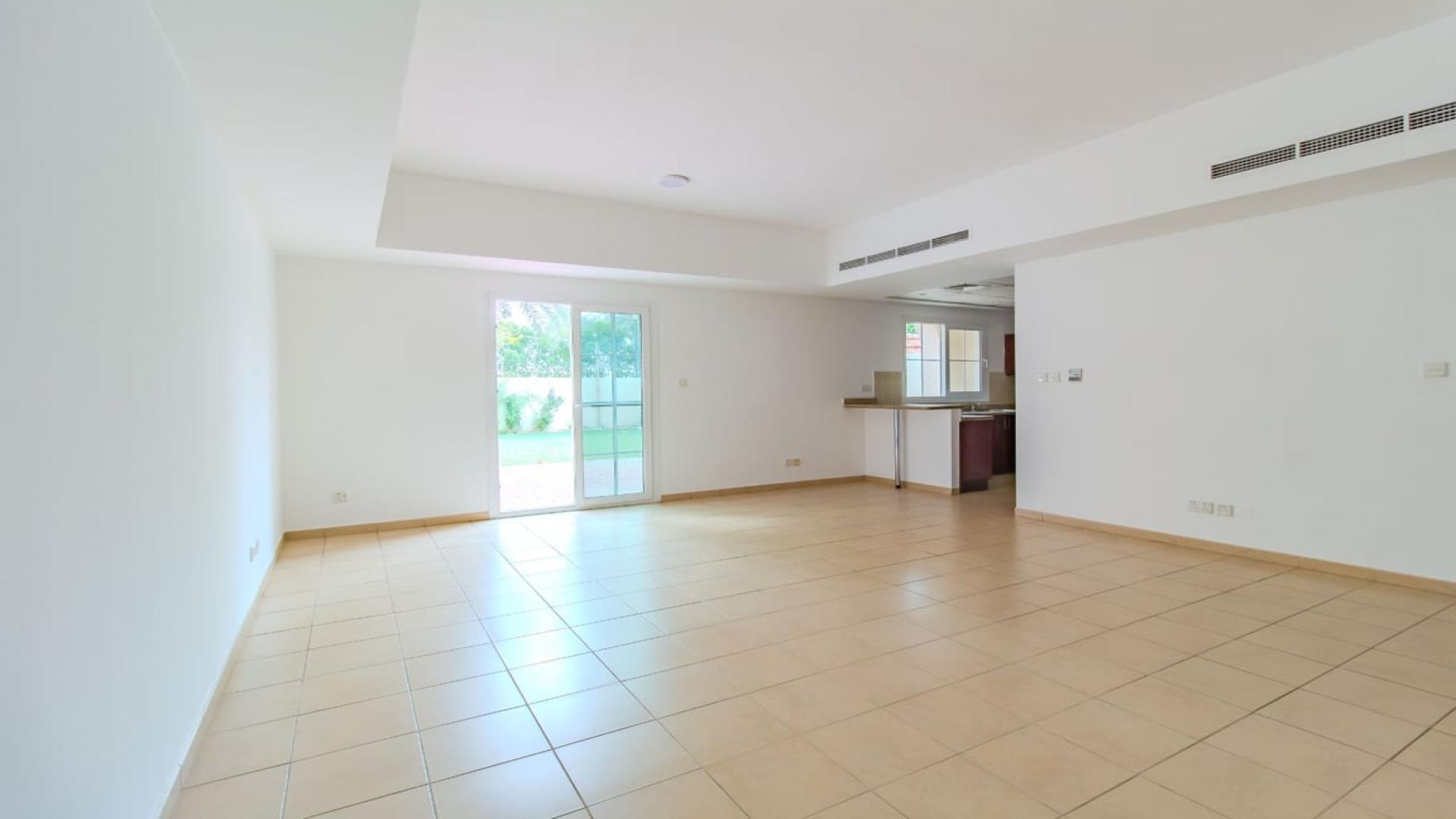 Balcony view from Type 3M Villa in Al Reem 1, Arabian Ranches, with lush greenery