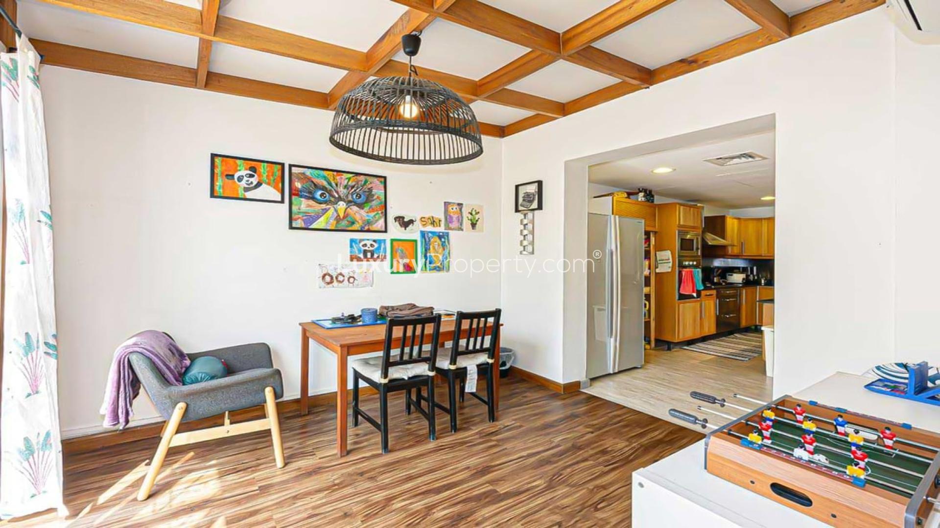 Living room in upgraded Type 2E villa, Springs 5, featuring stylish decor and natural light