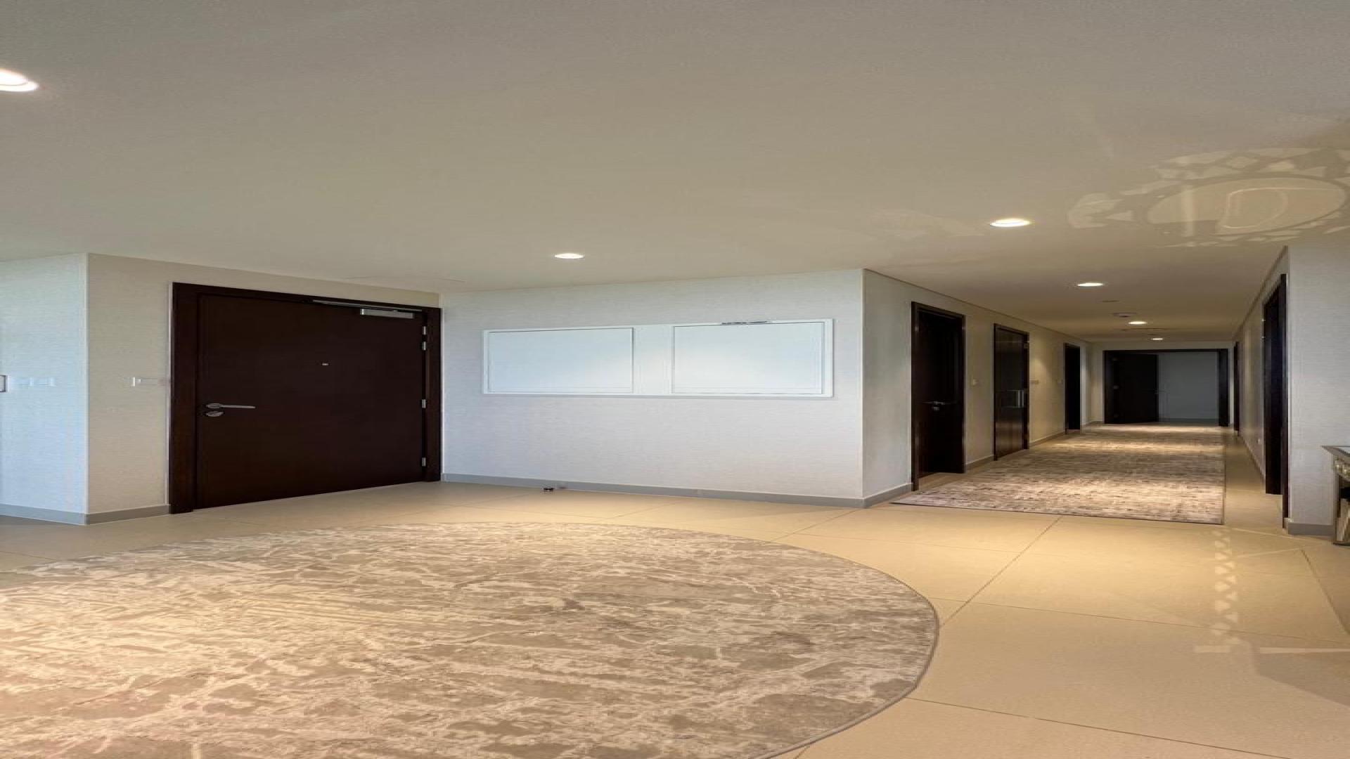 Luxurious living room in Dubai Hills apartment, featuring elegant furnishings and modern decor